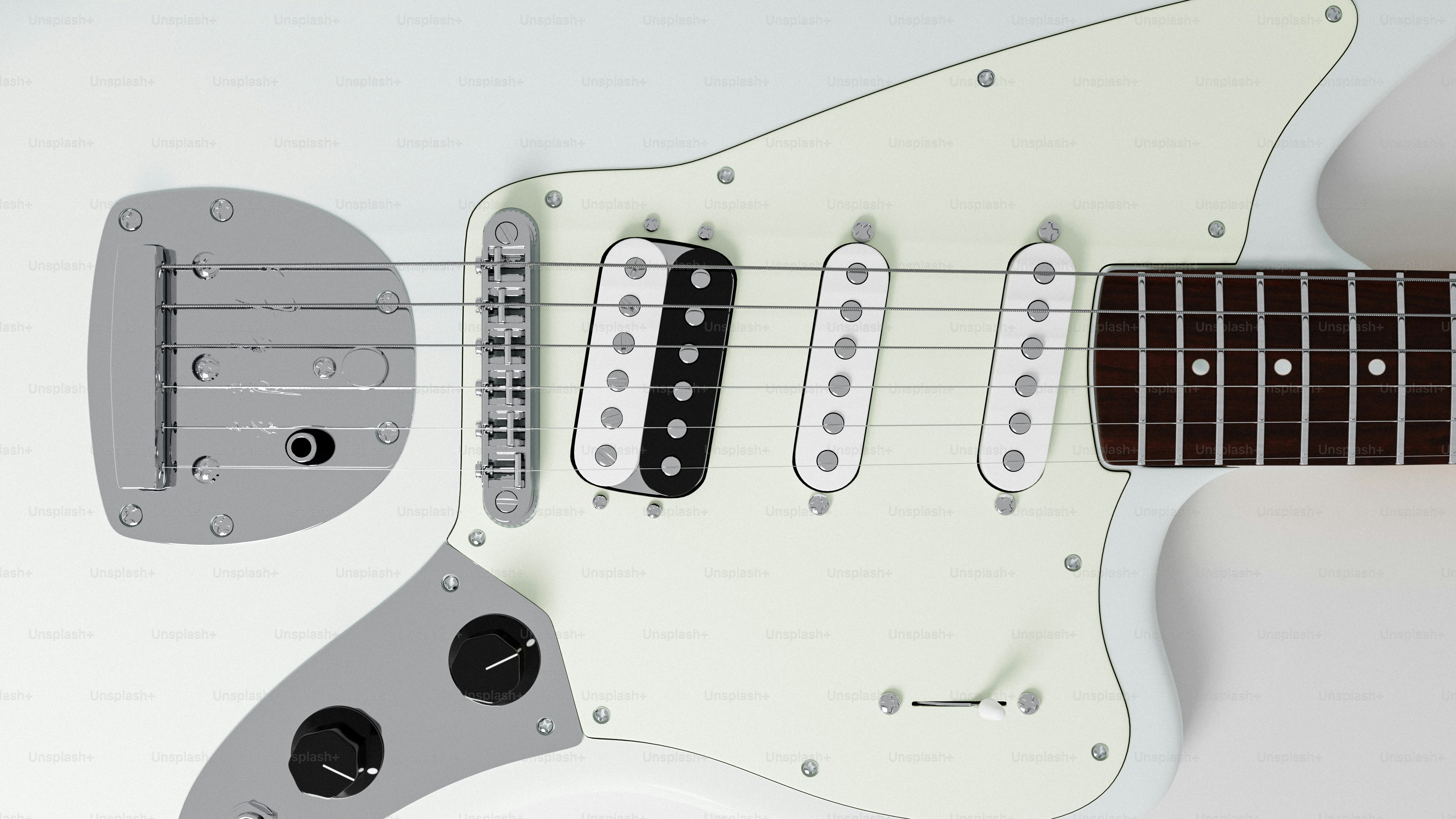 Close-up of a white electric guitar with black pickups.