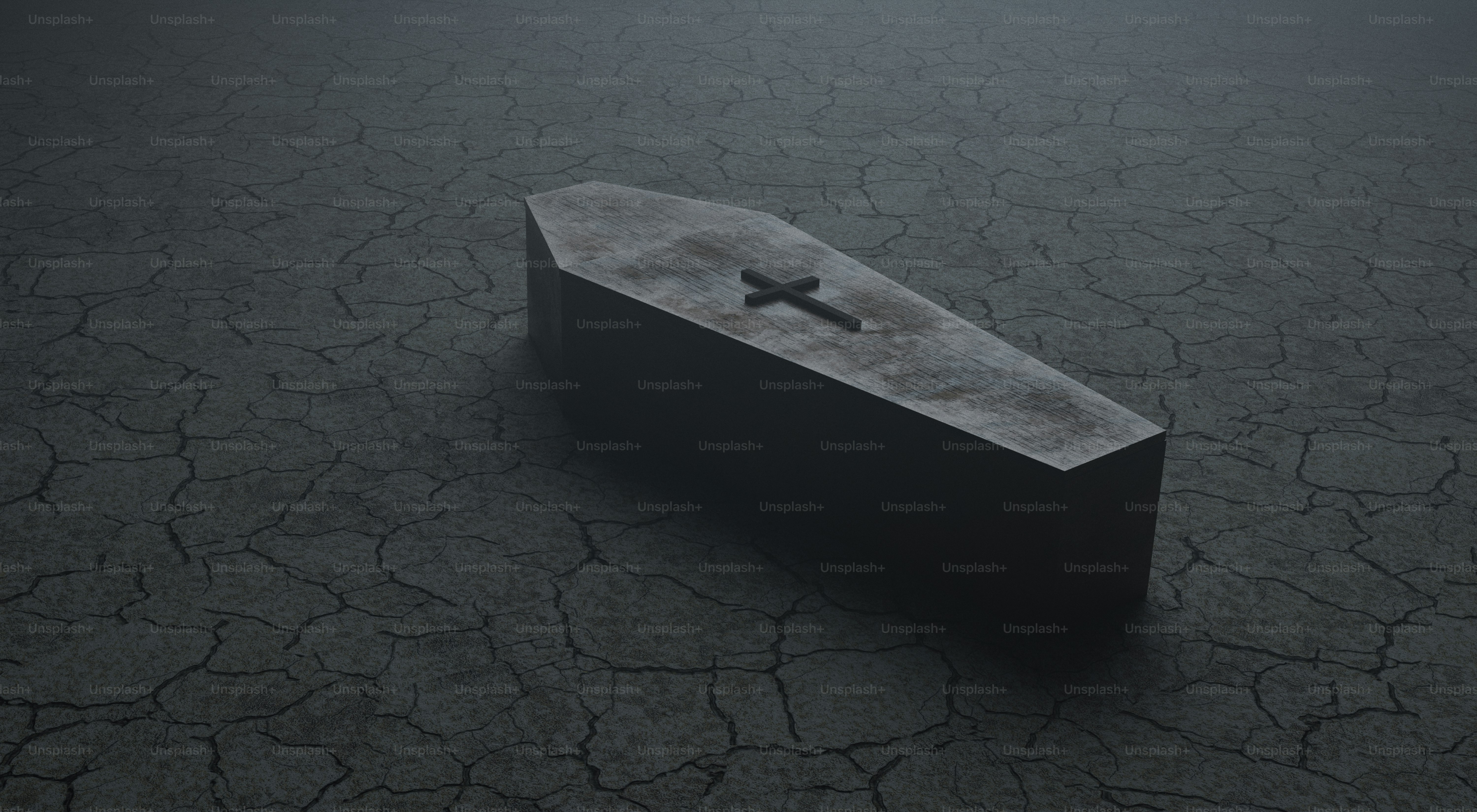 A stone coffin with a cross on a cracked surface