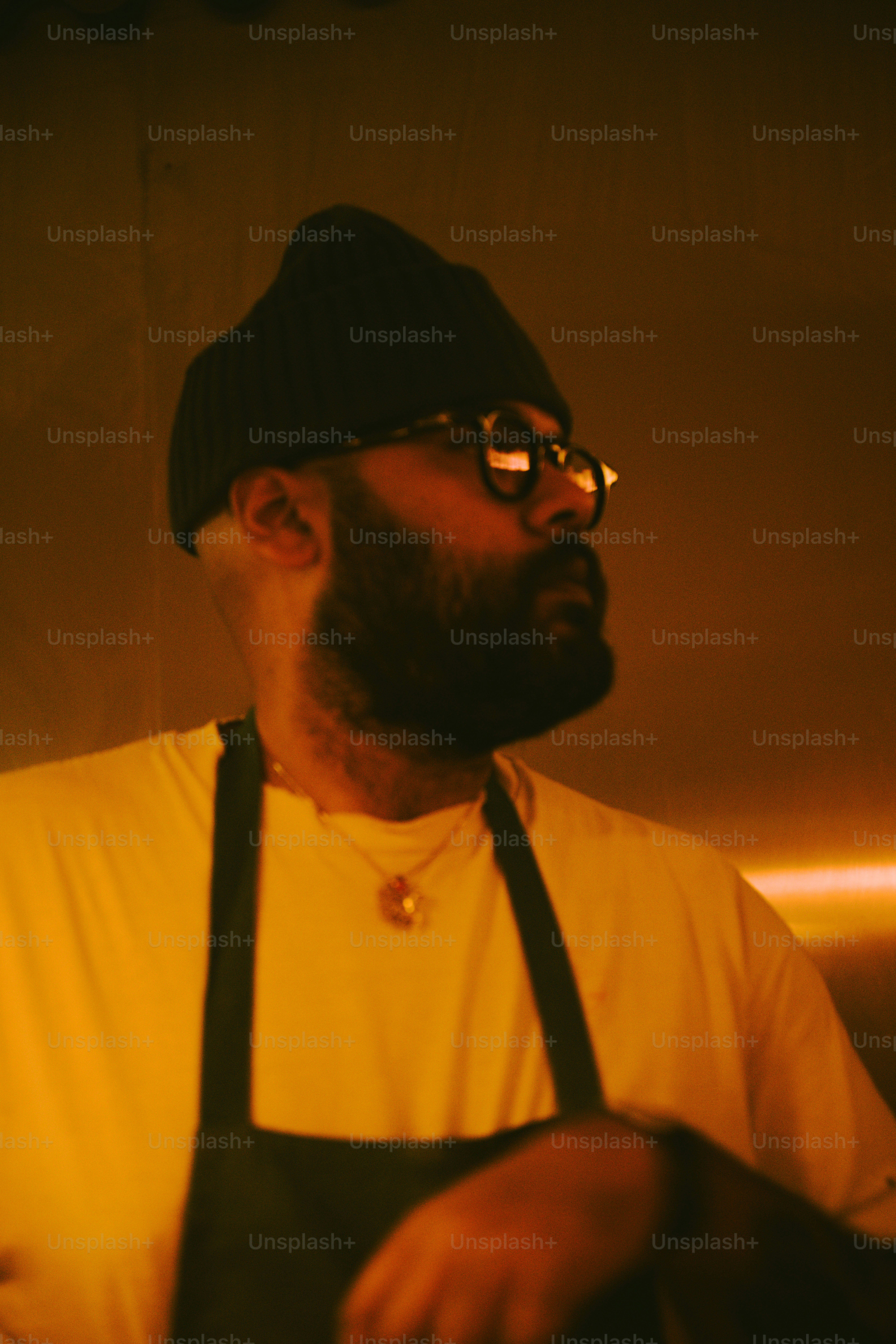 Man with beard wearing beanie and glasses