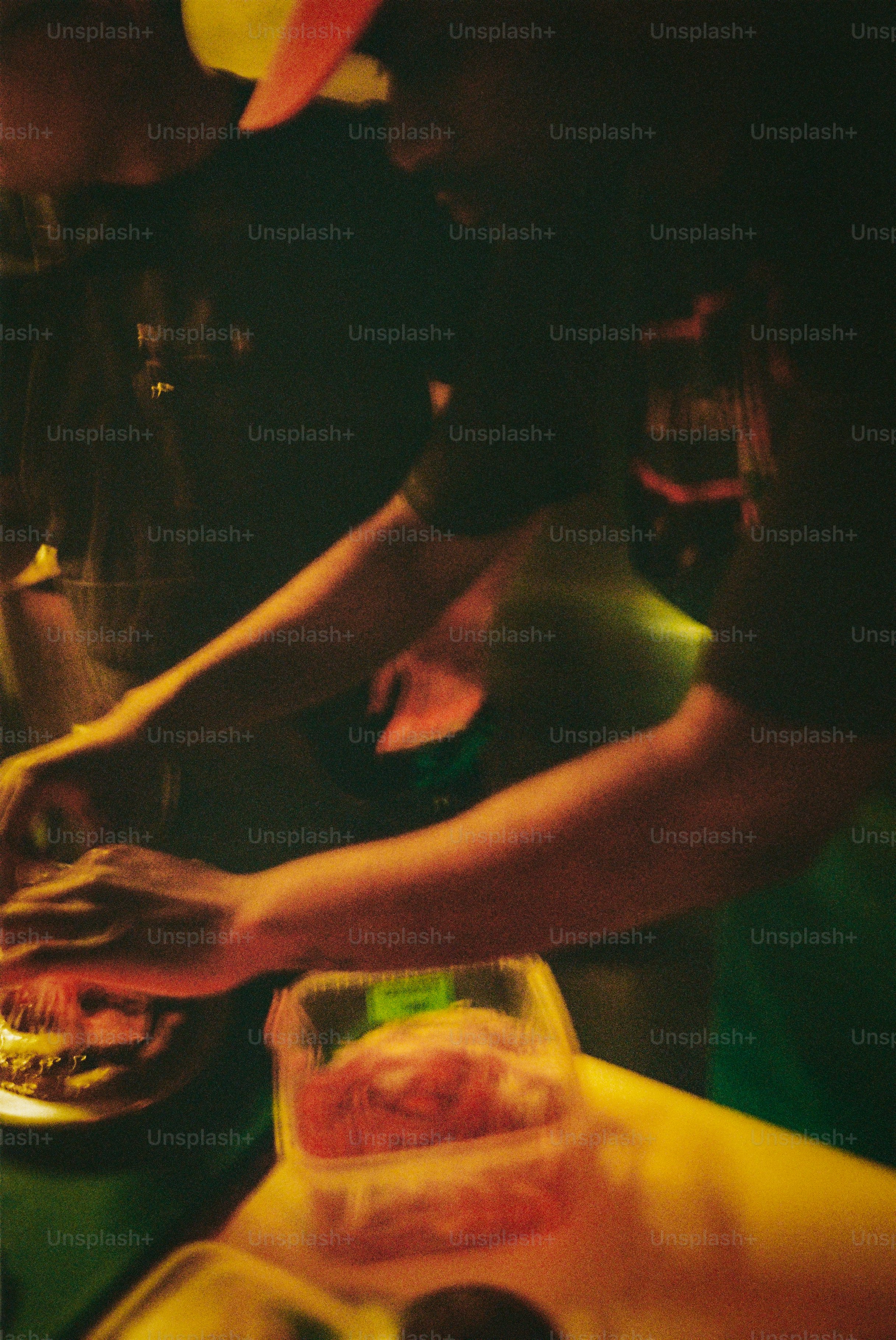 People preparing food together at a table.