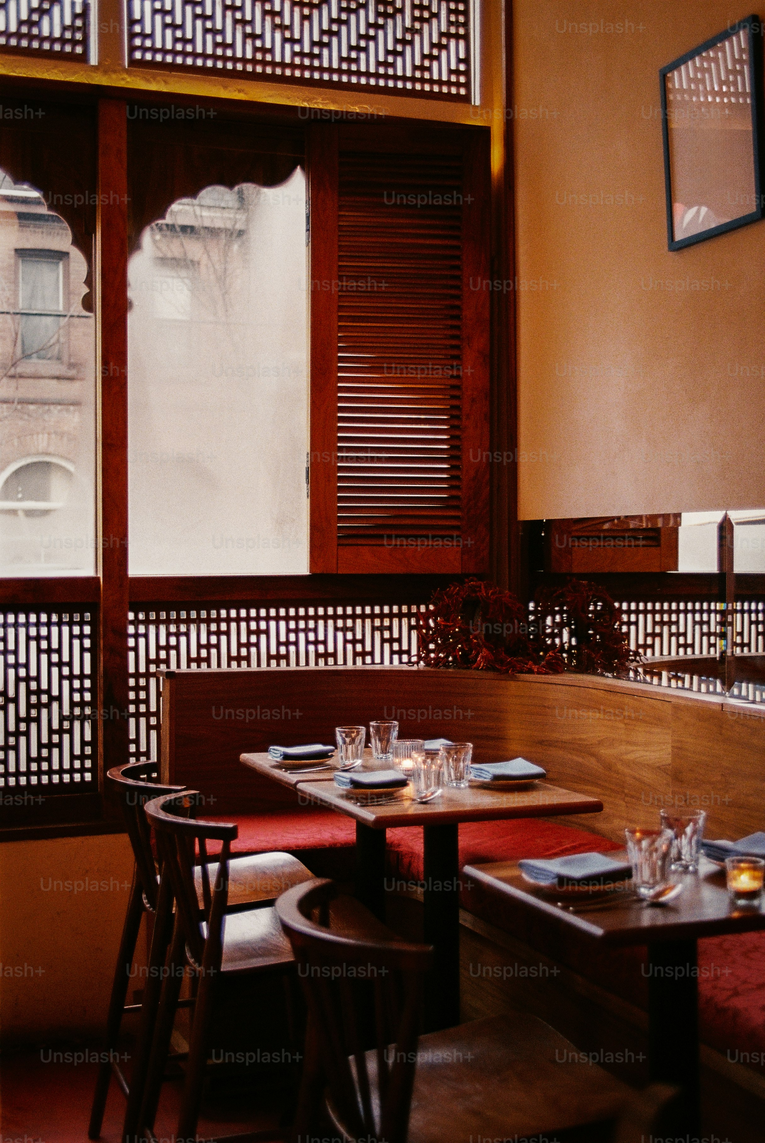 Restaurant dining tables set for service.