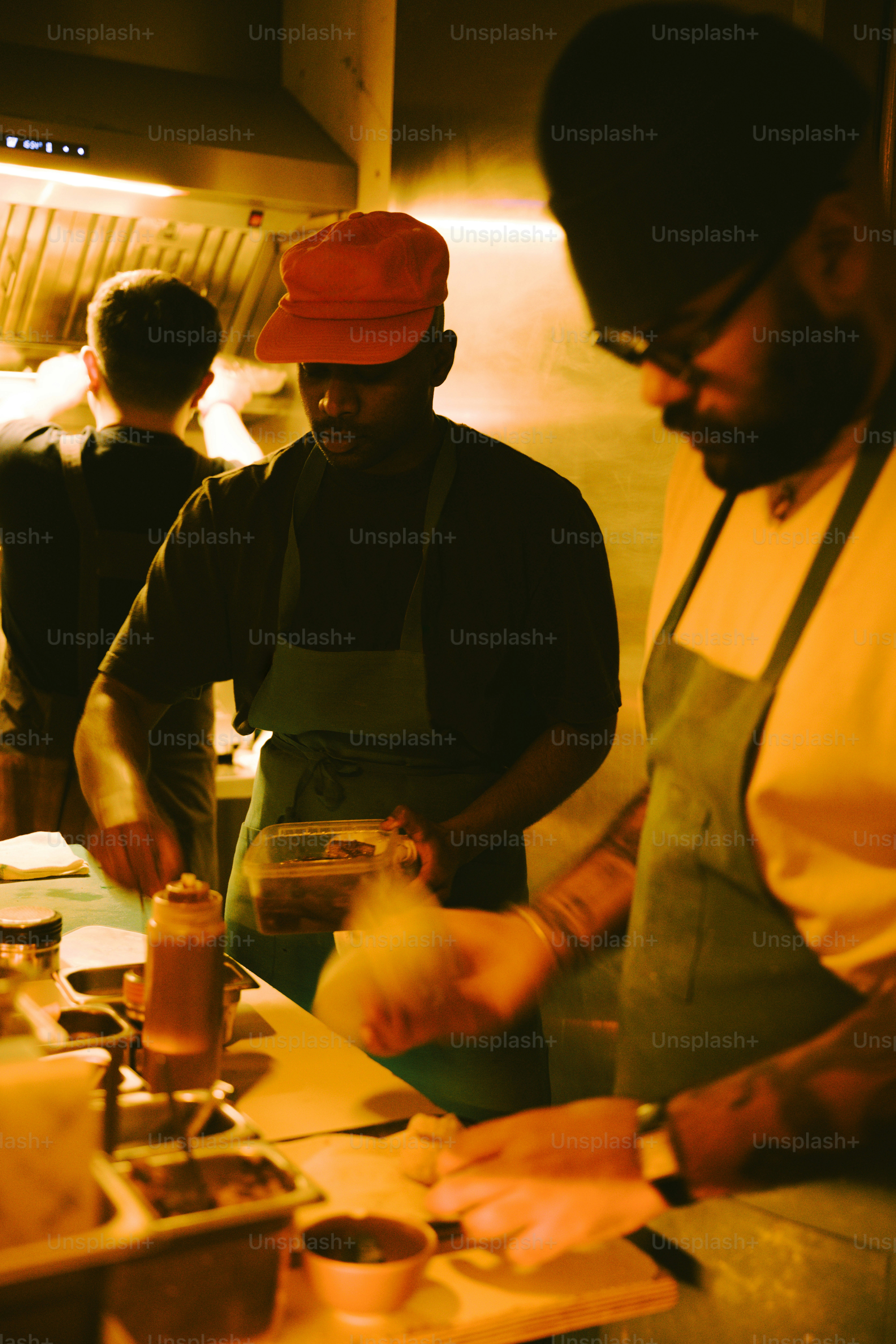 Chefs working together in a busy kitchen