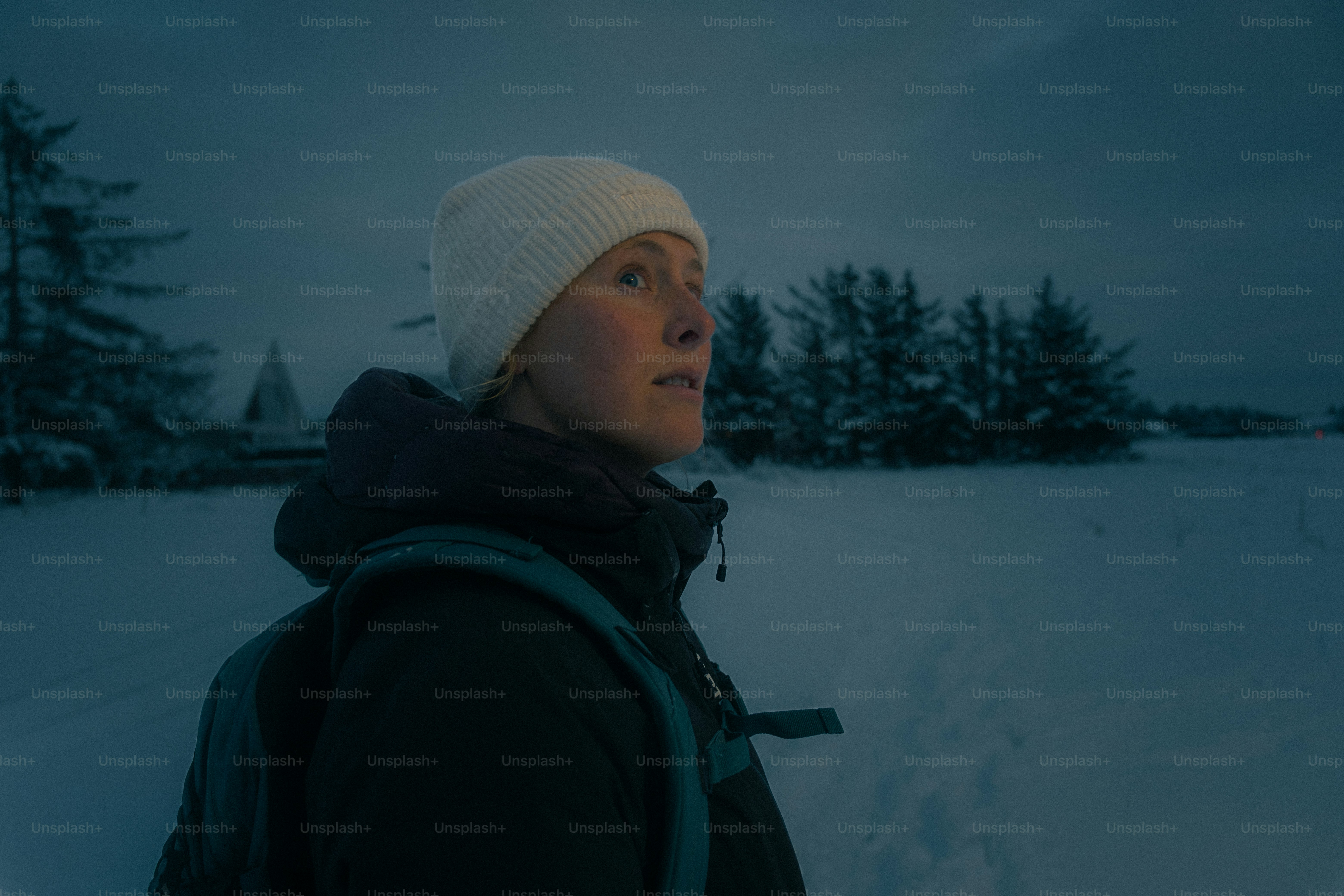 Woman in a snowy landscape looking away