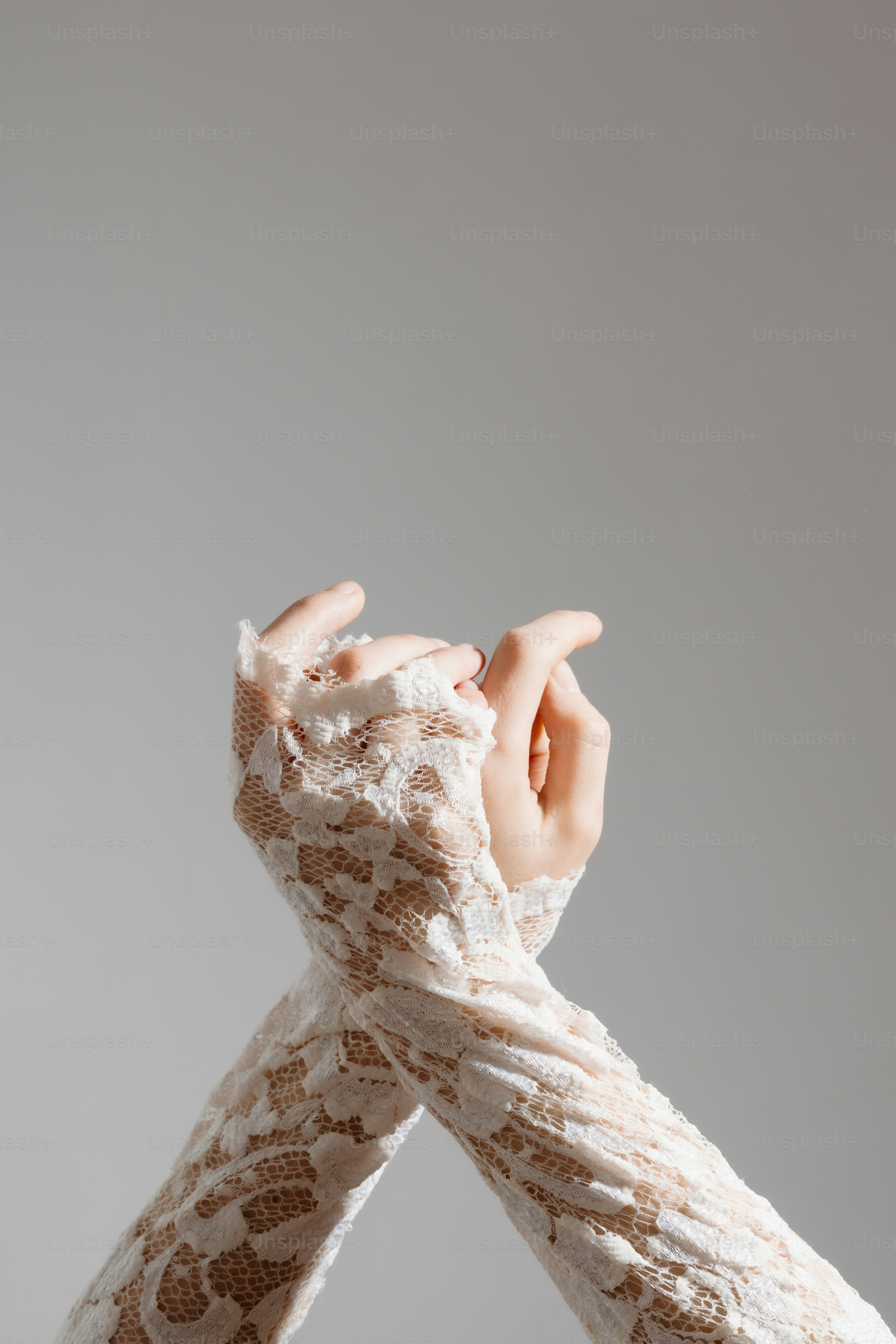 Delicate lace sleeves cover intertwined hands photo – Pattern Image on ...