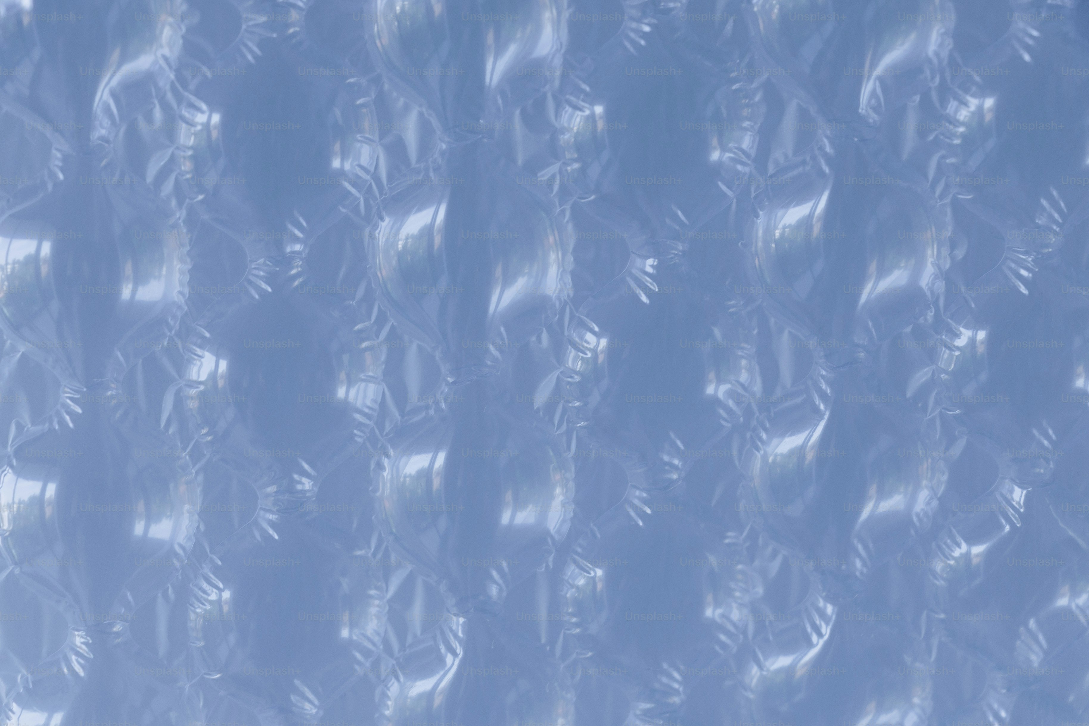 Abstract pattern of light and shadow on blue