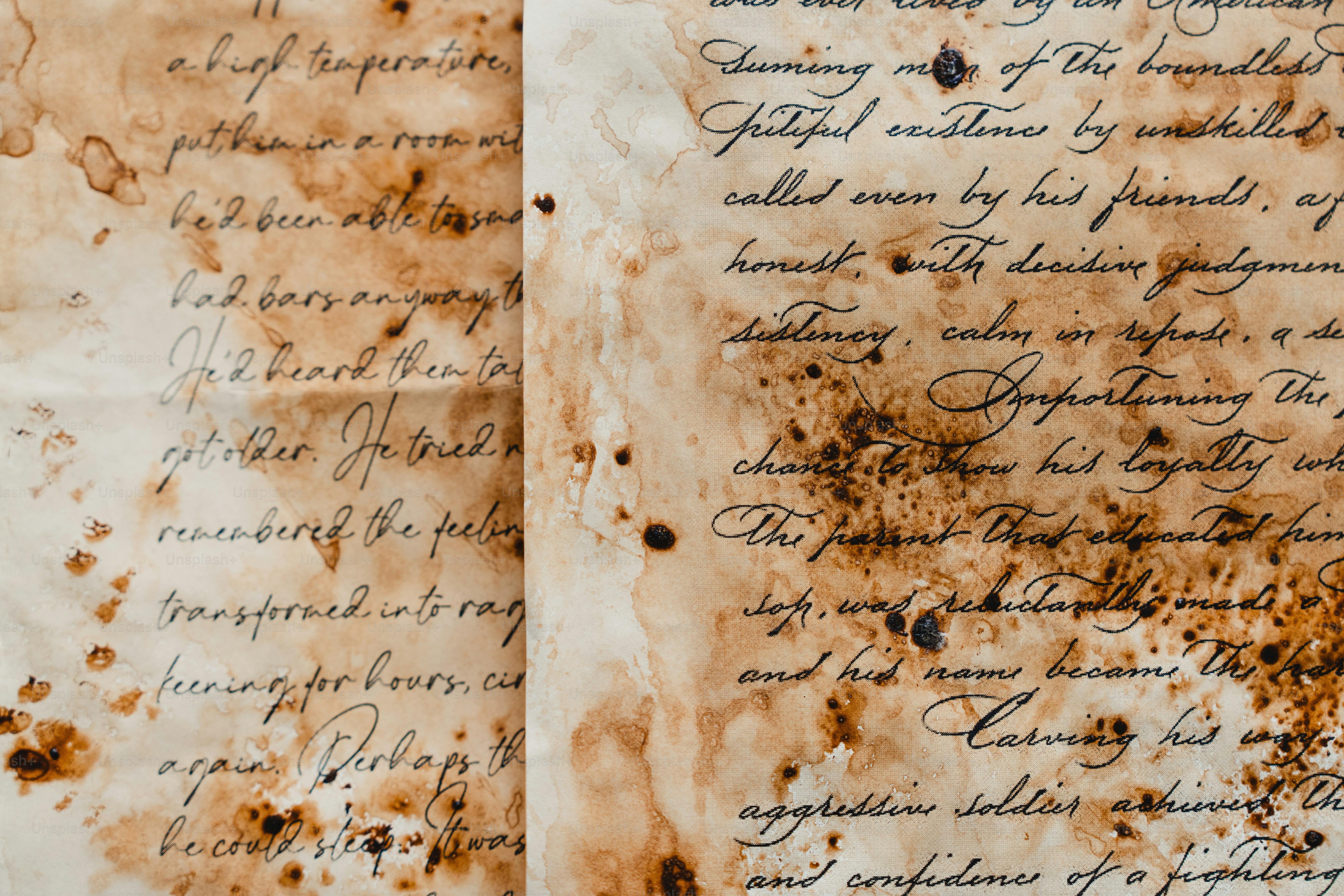 Aged, stained parchment with handwritten text.