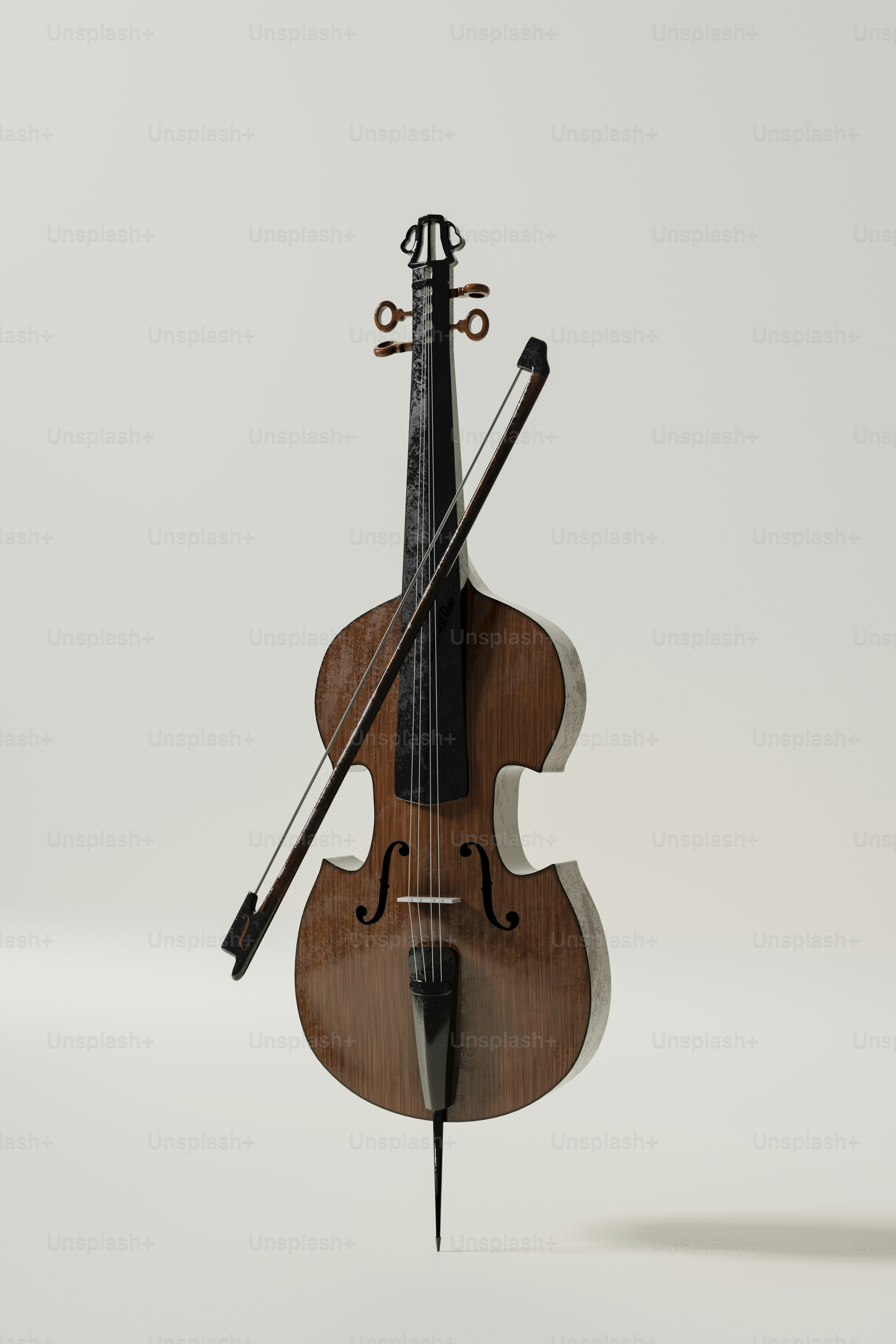 Um violoncelo com um arco apoiado nele