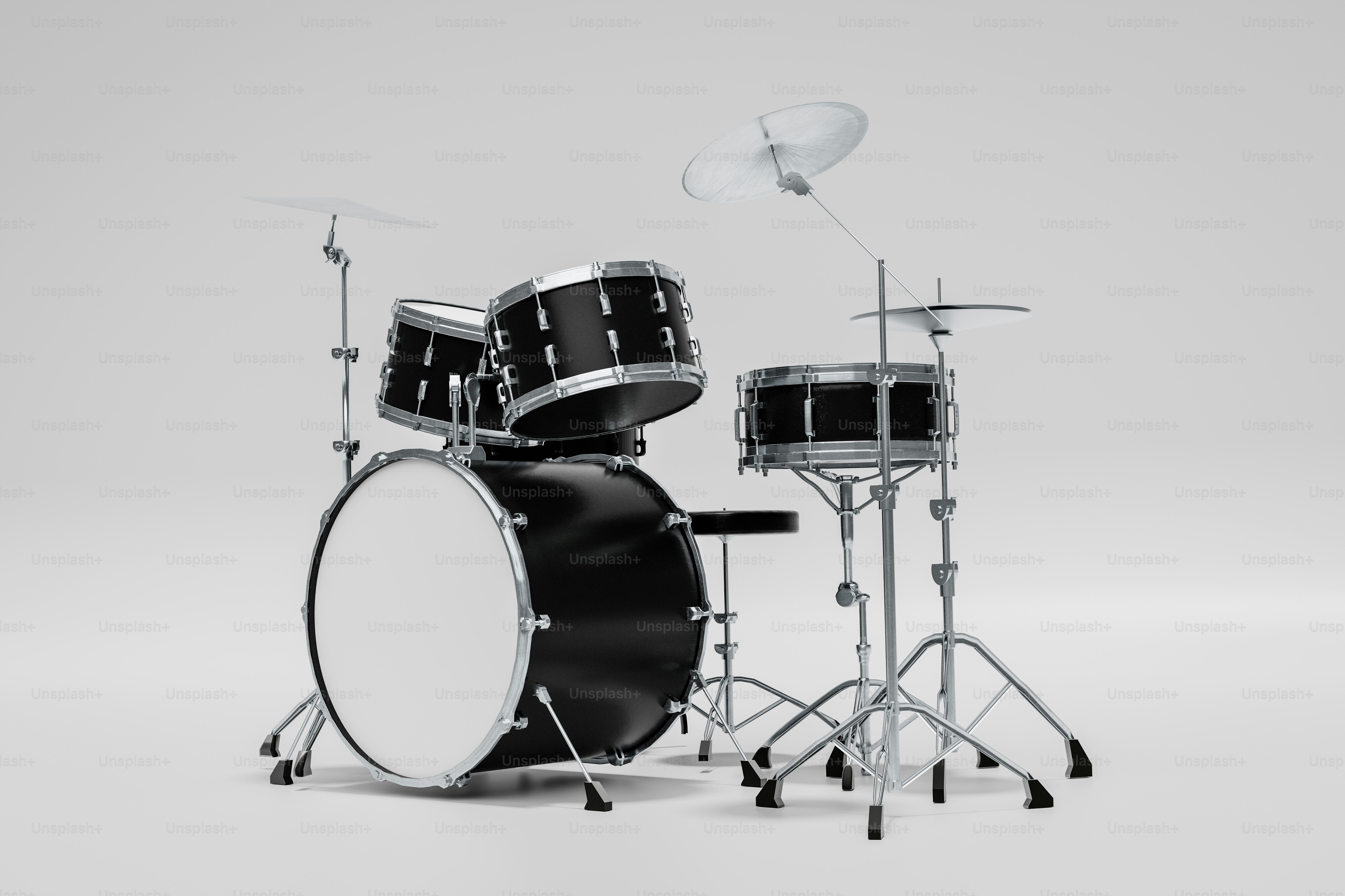 Um kit de bateria preto sobre fundo branco