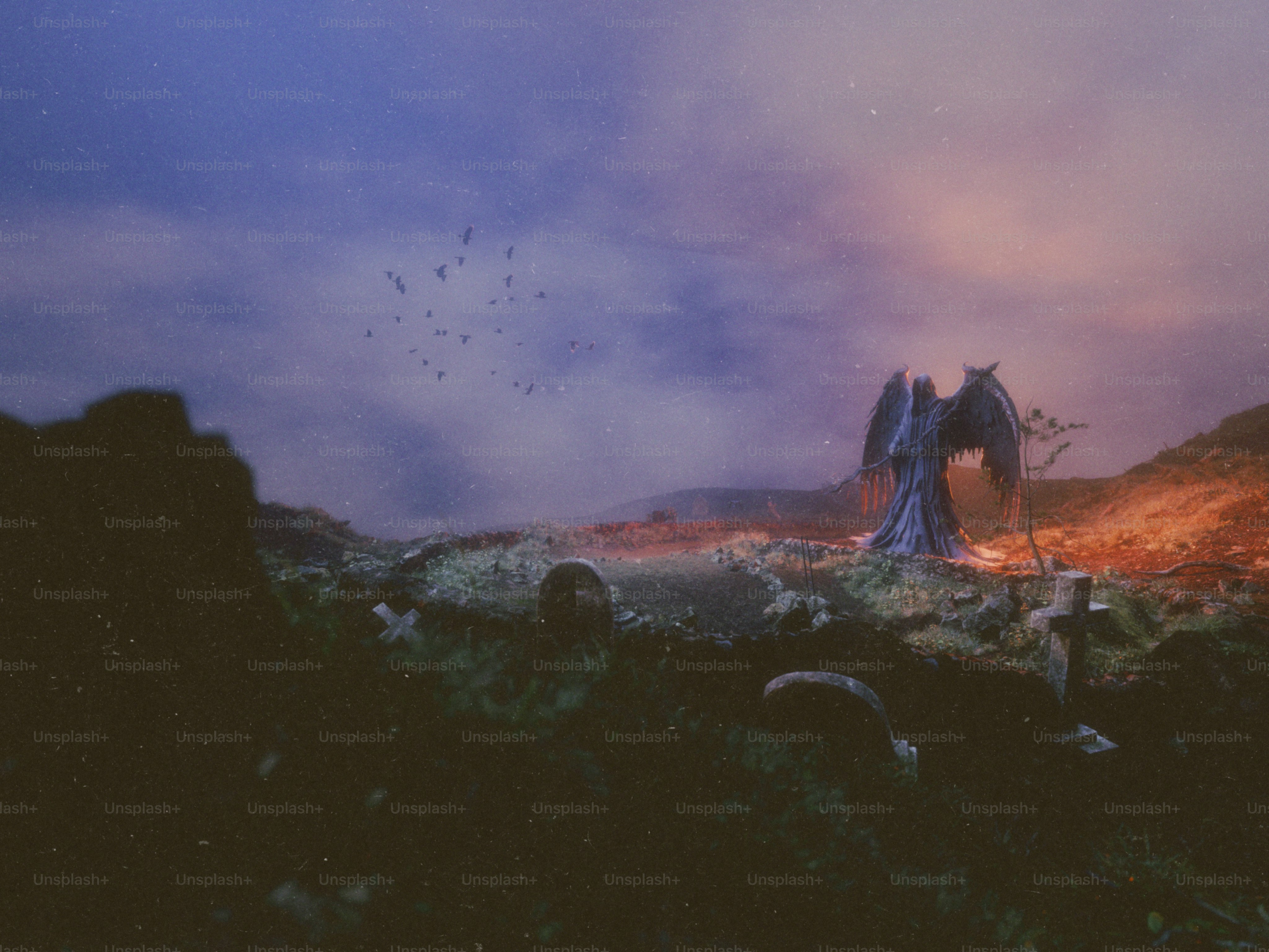 Angel statue in a desolate landscape at dusk
