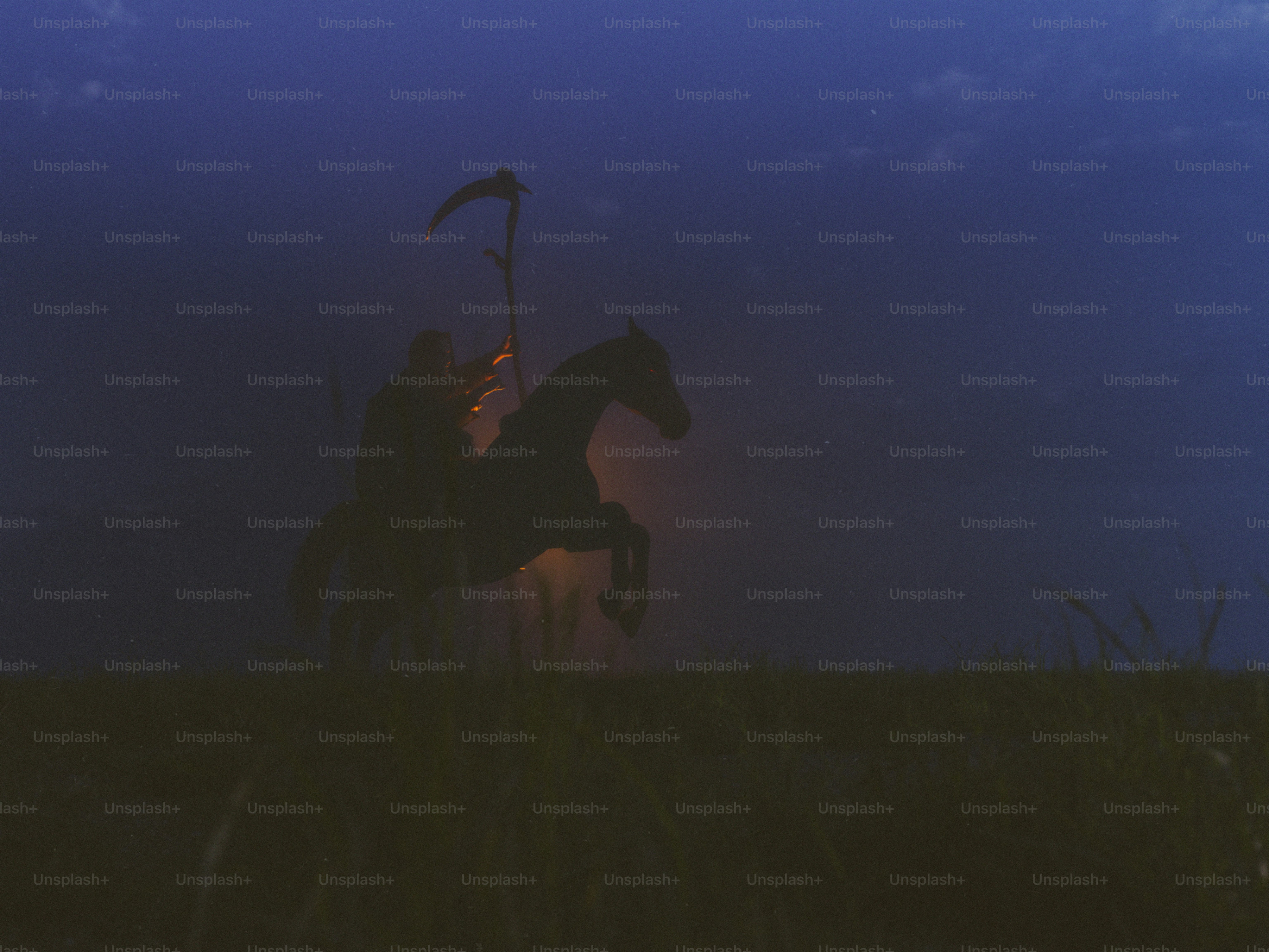 Grim reaper on a horse in a dark field
