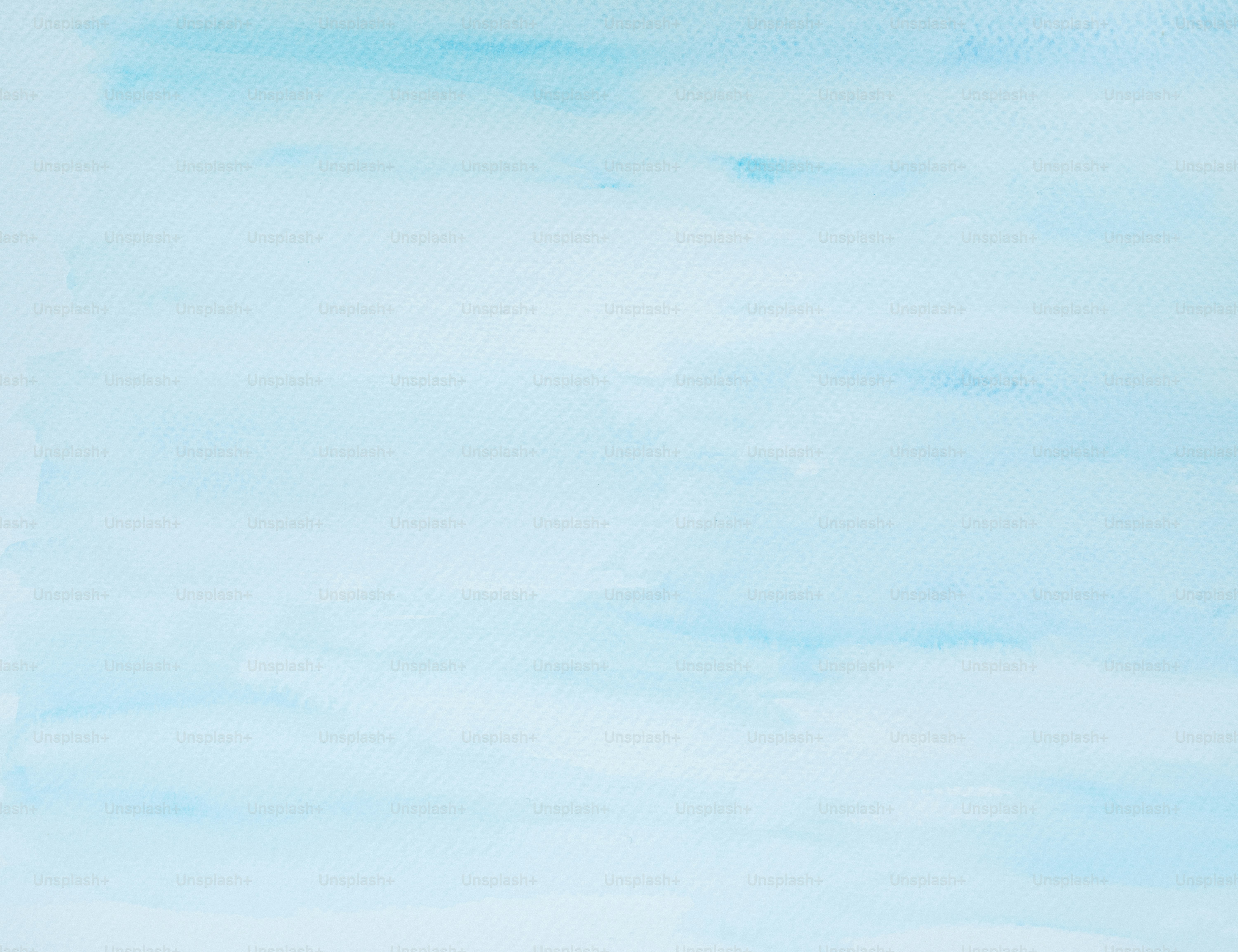 Pale blue watercolor wash background