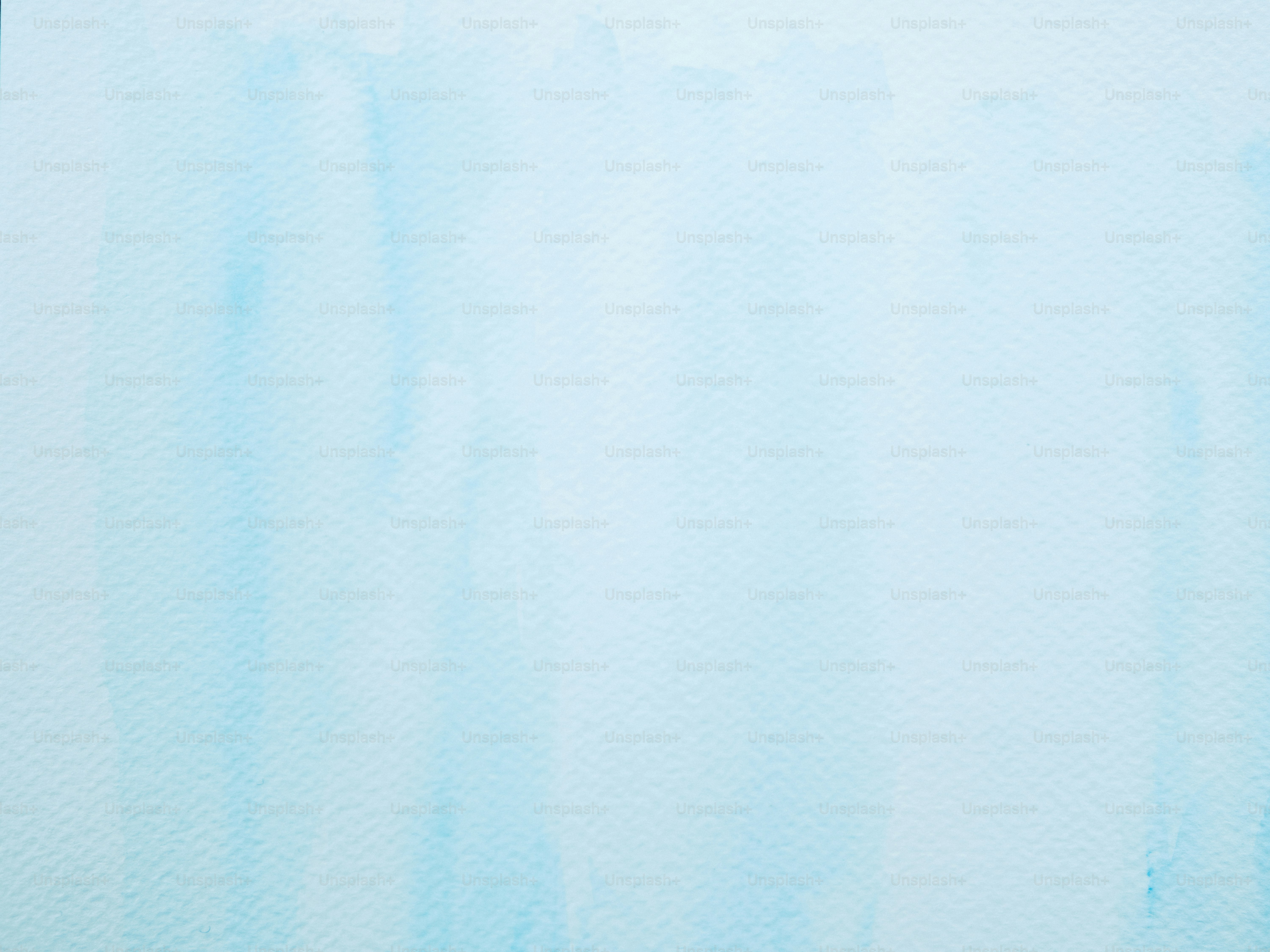 Soft blue watercolor wash background