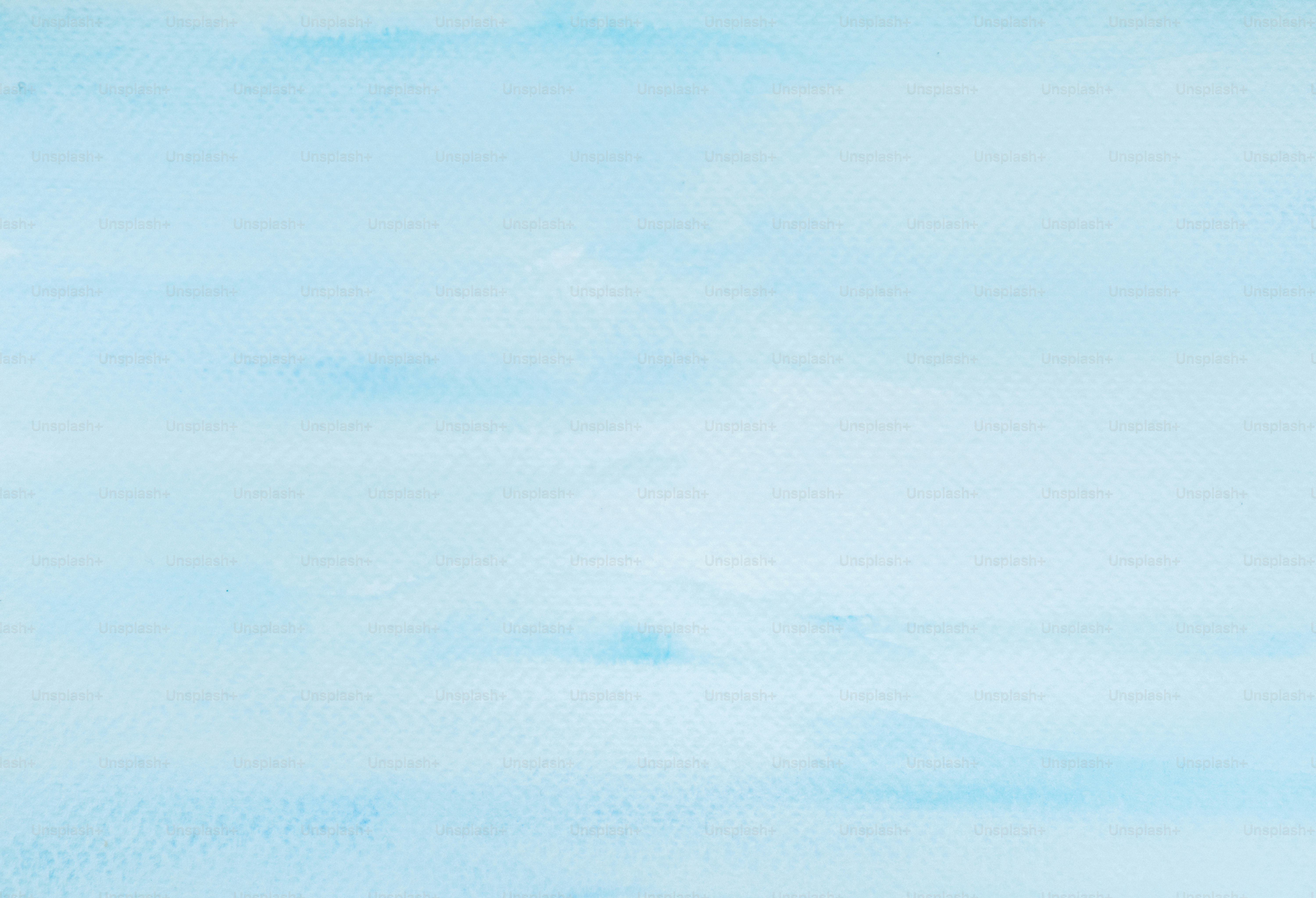 Soft blue watercolor background with subtle texture