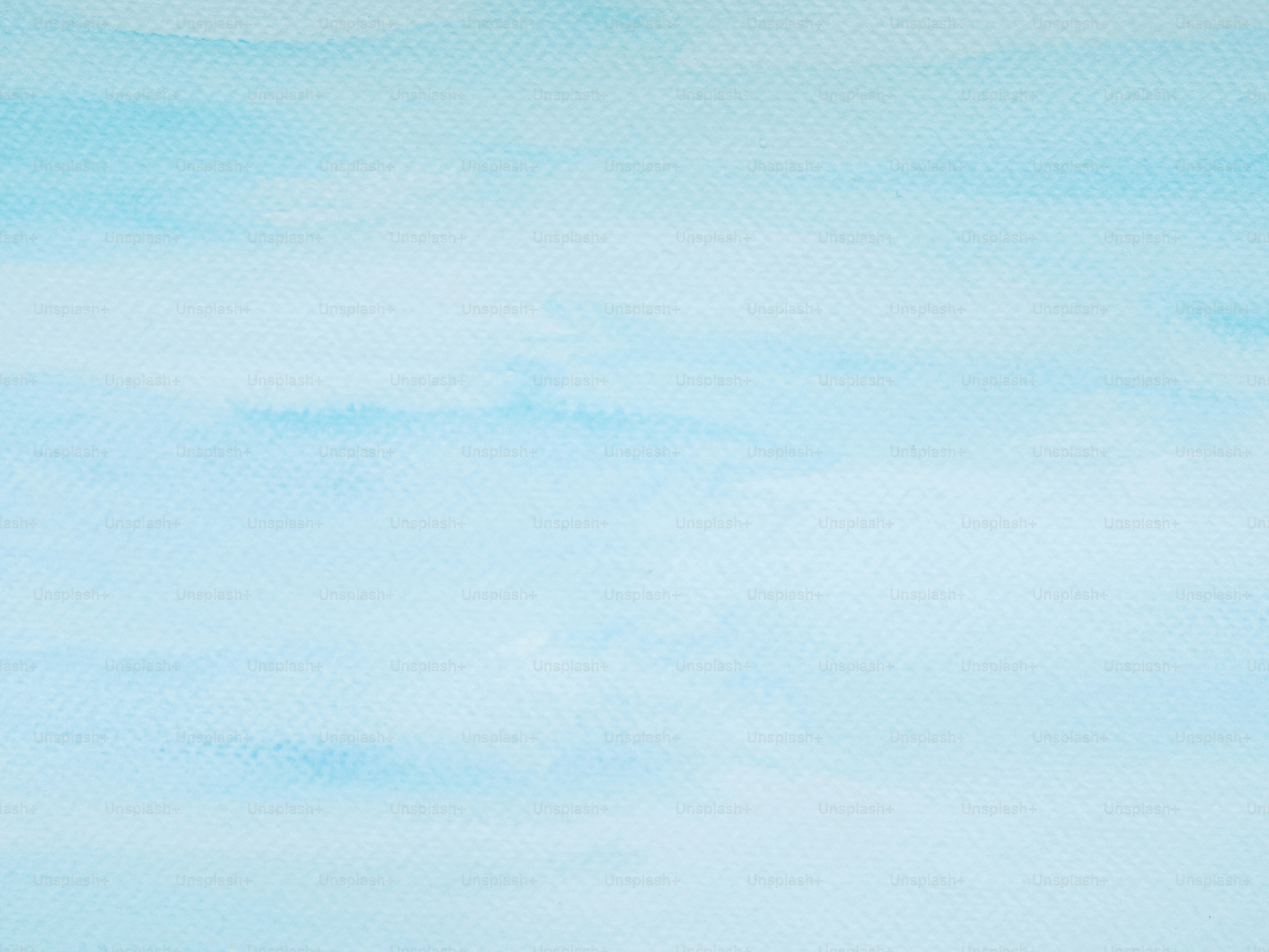 Soft blue watercolor wash background