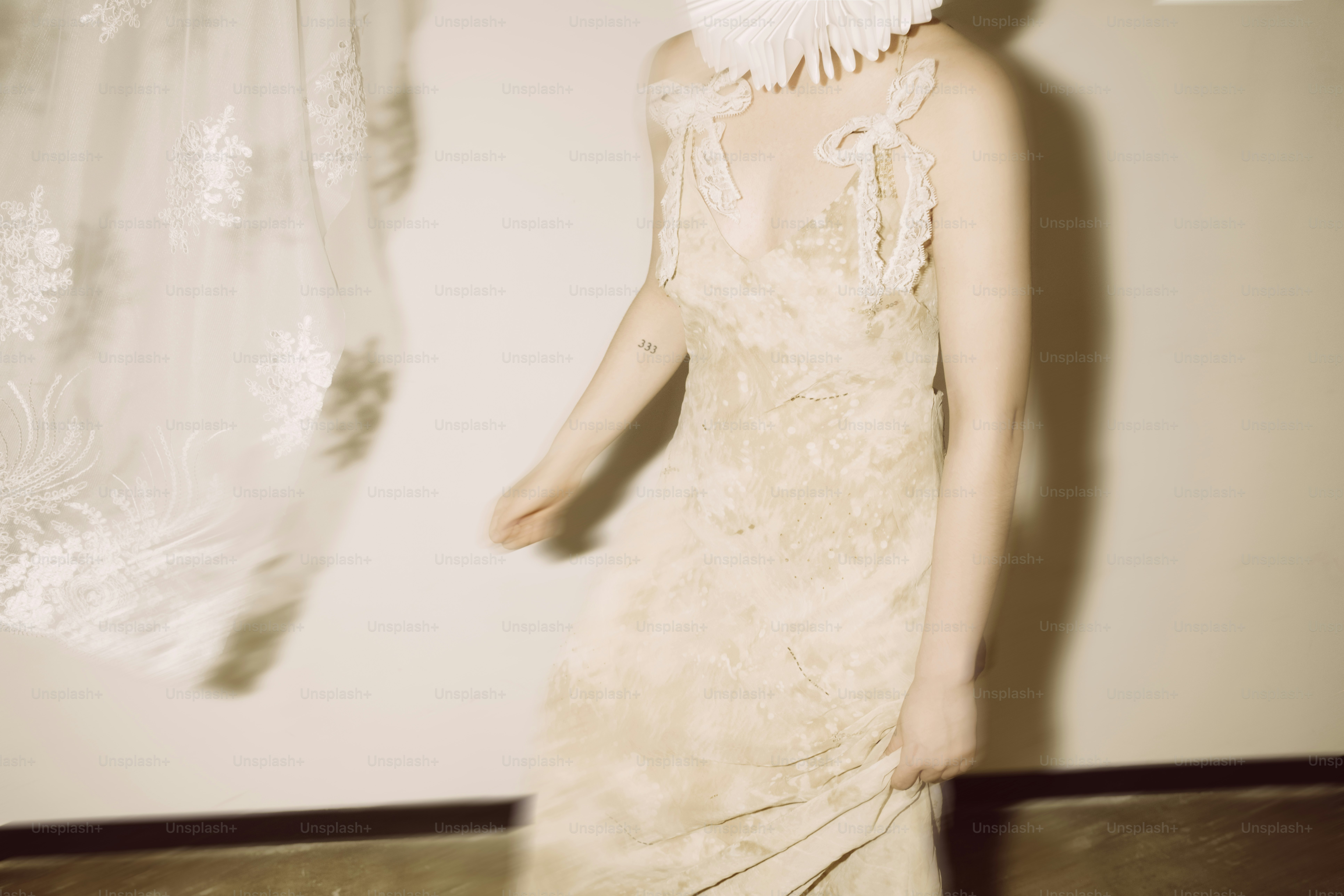 Woman in a delicate lace dress with ornate headpiece