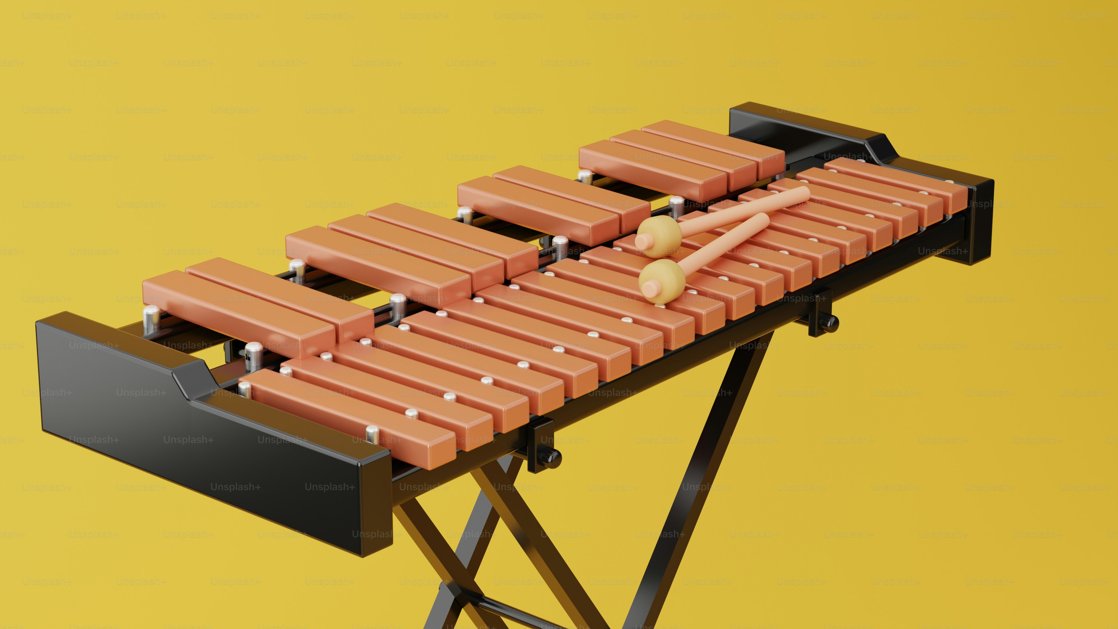 Un xylophone en bois avec des maillets sur un support