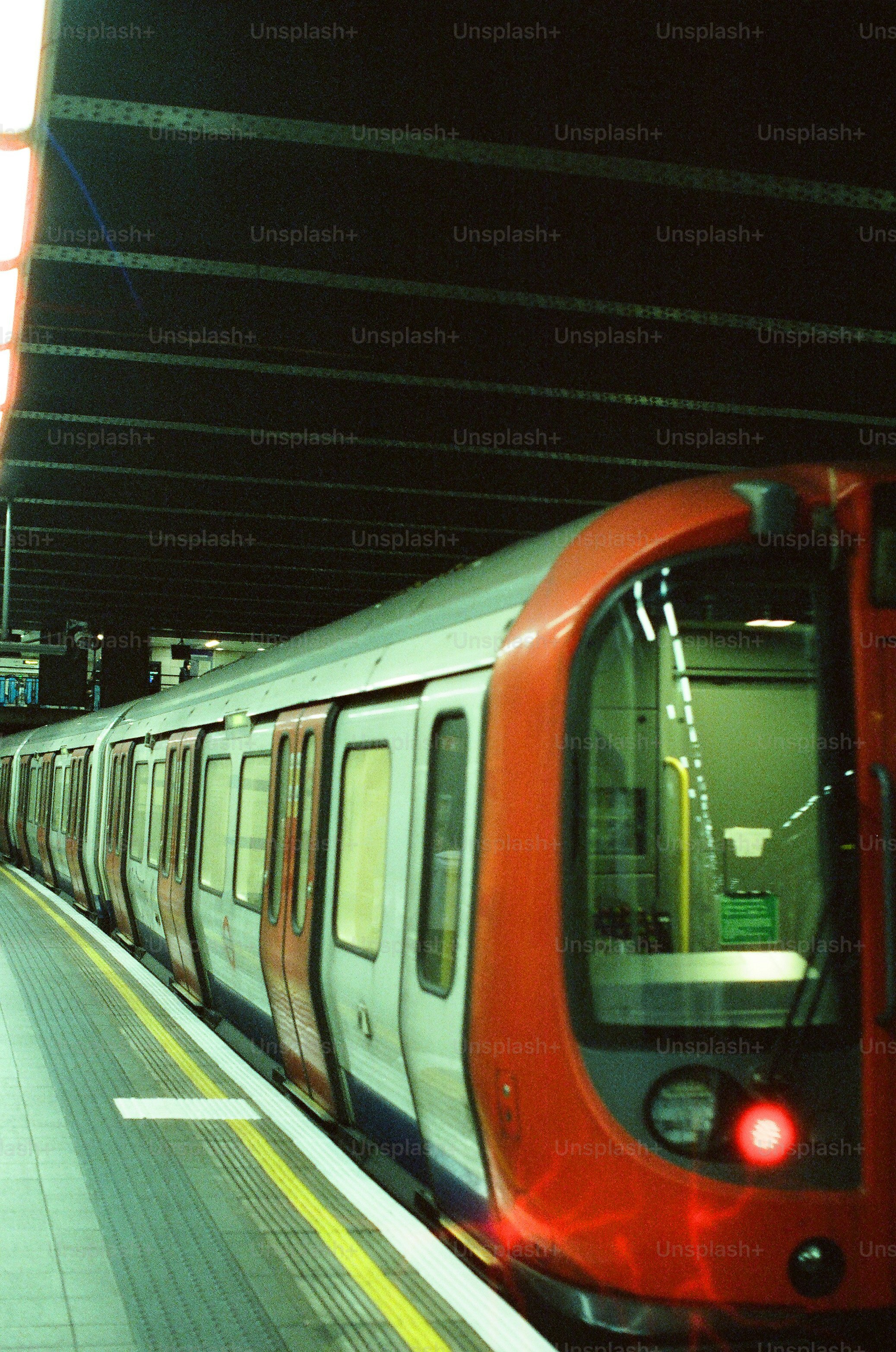 A train waits at a subway station platform.