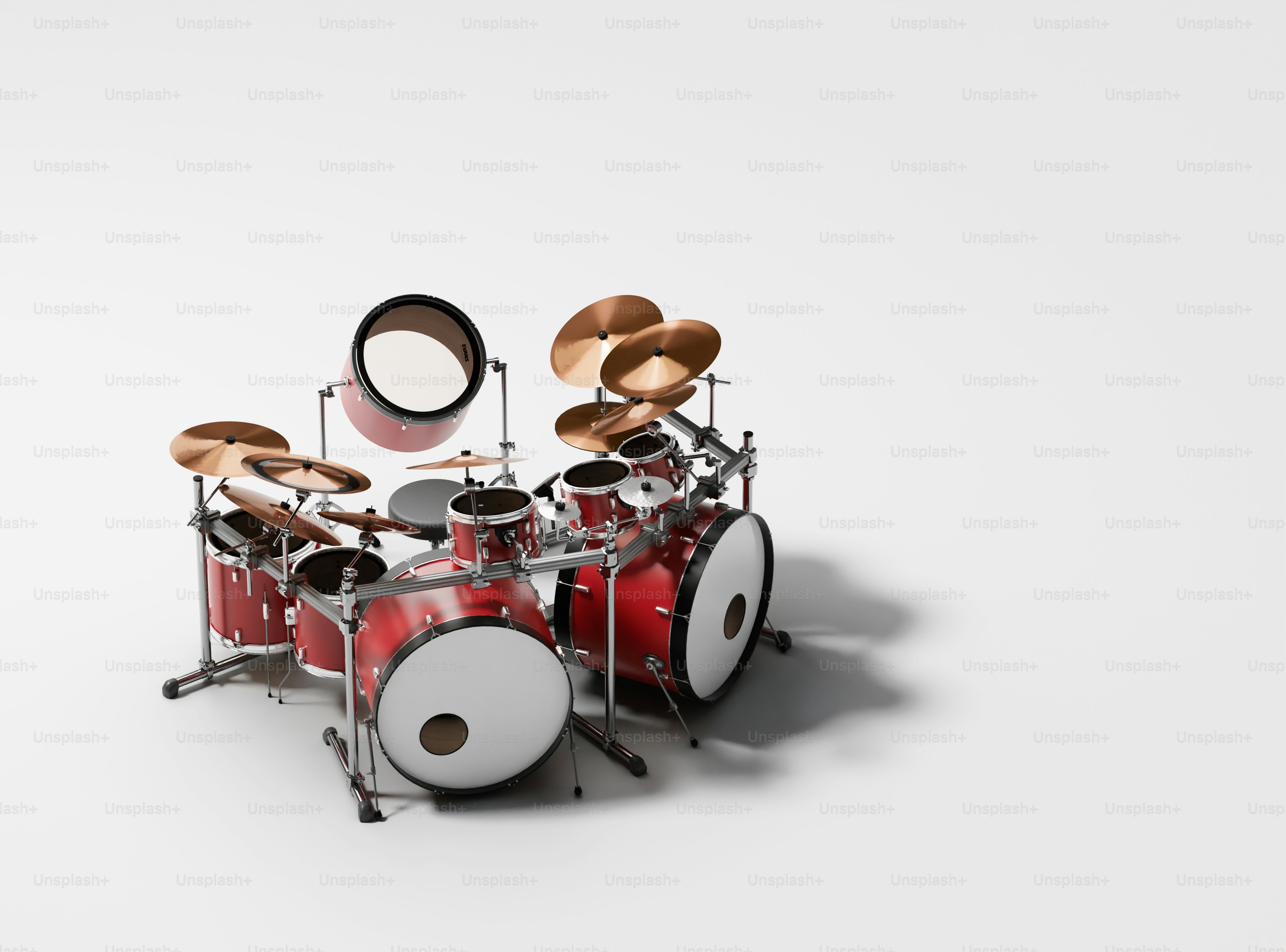 A red drum set on a white background