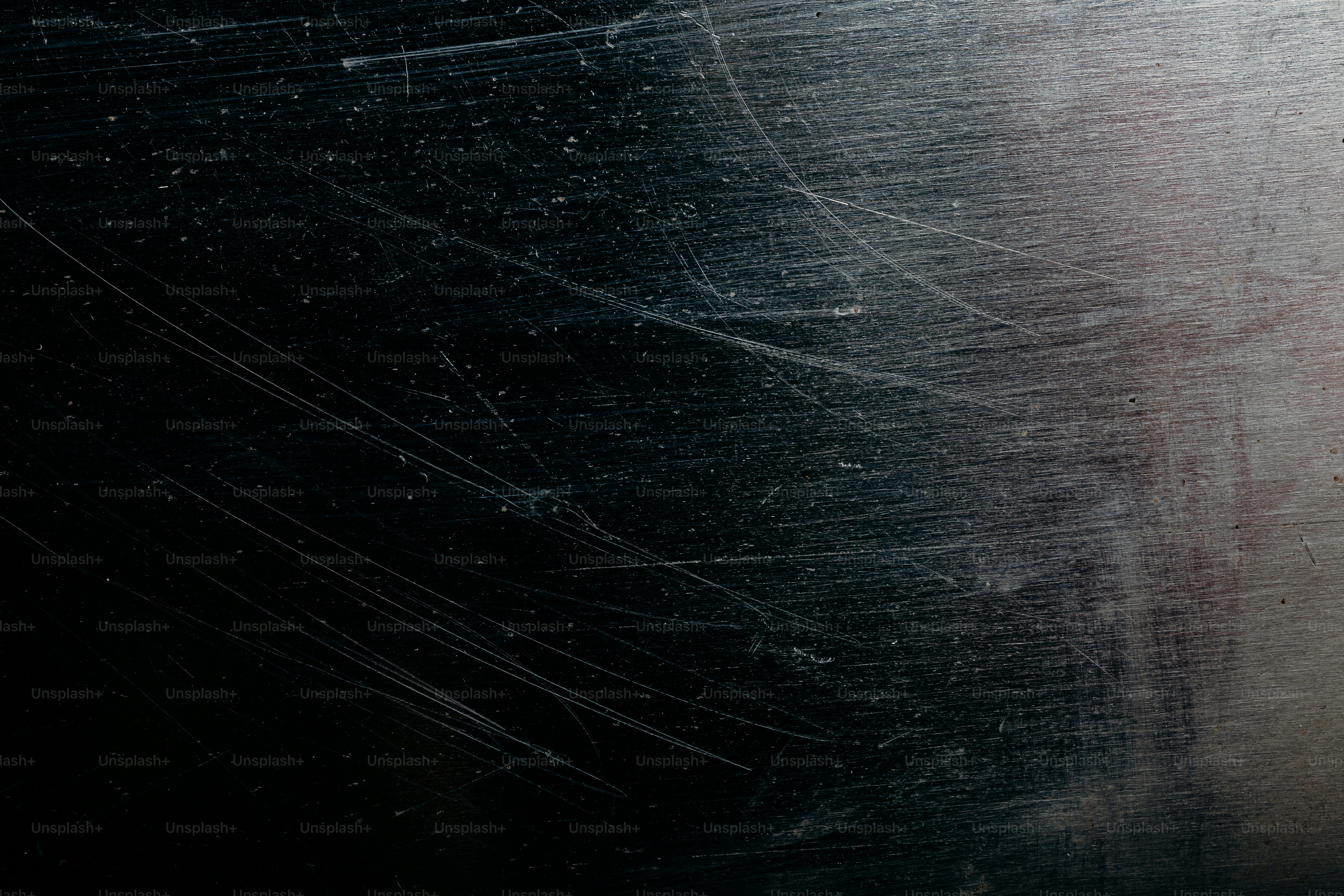 Scratched metallic surface with dust particles