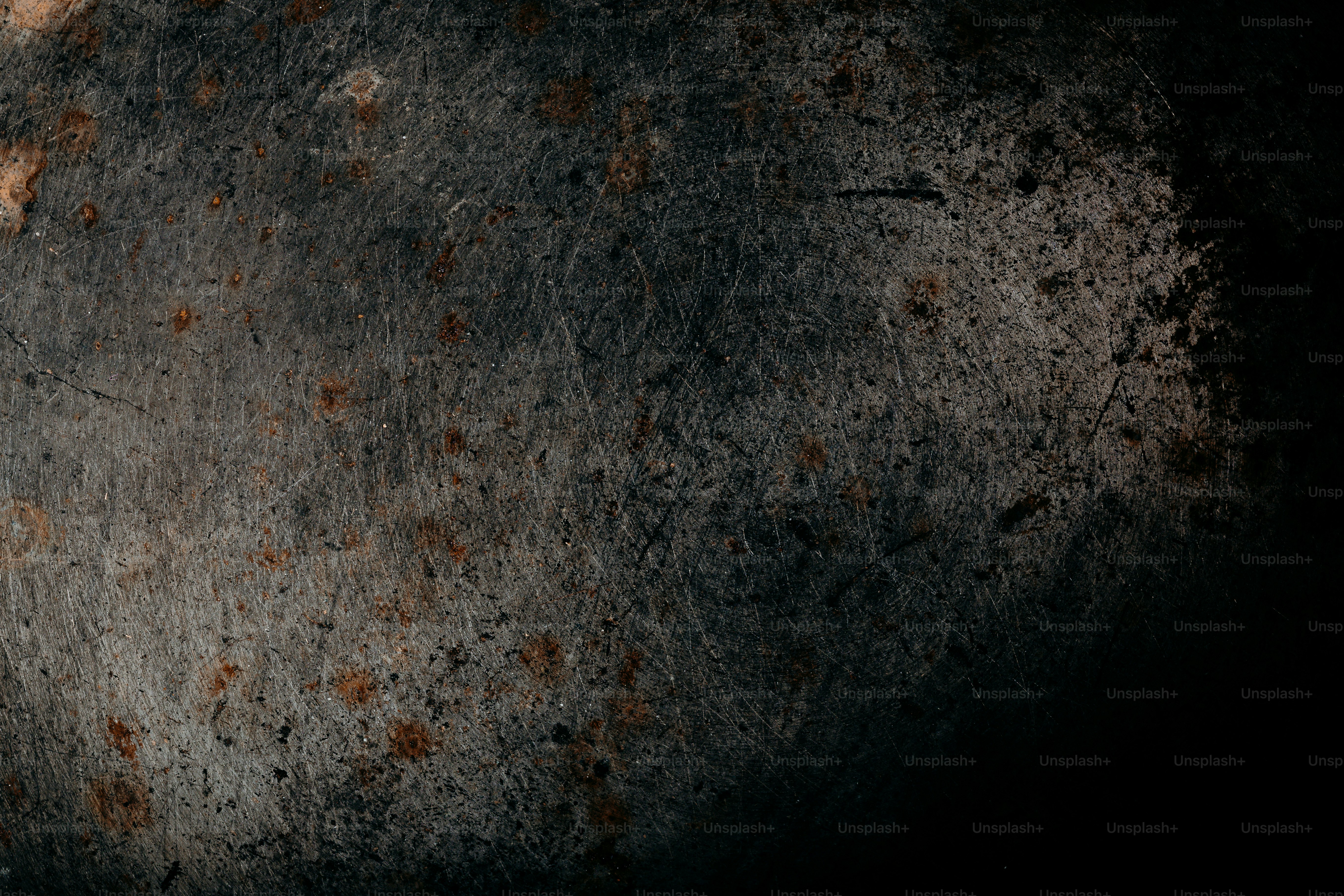 Close-up of a rusty metal surface with scratches.