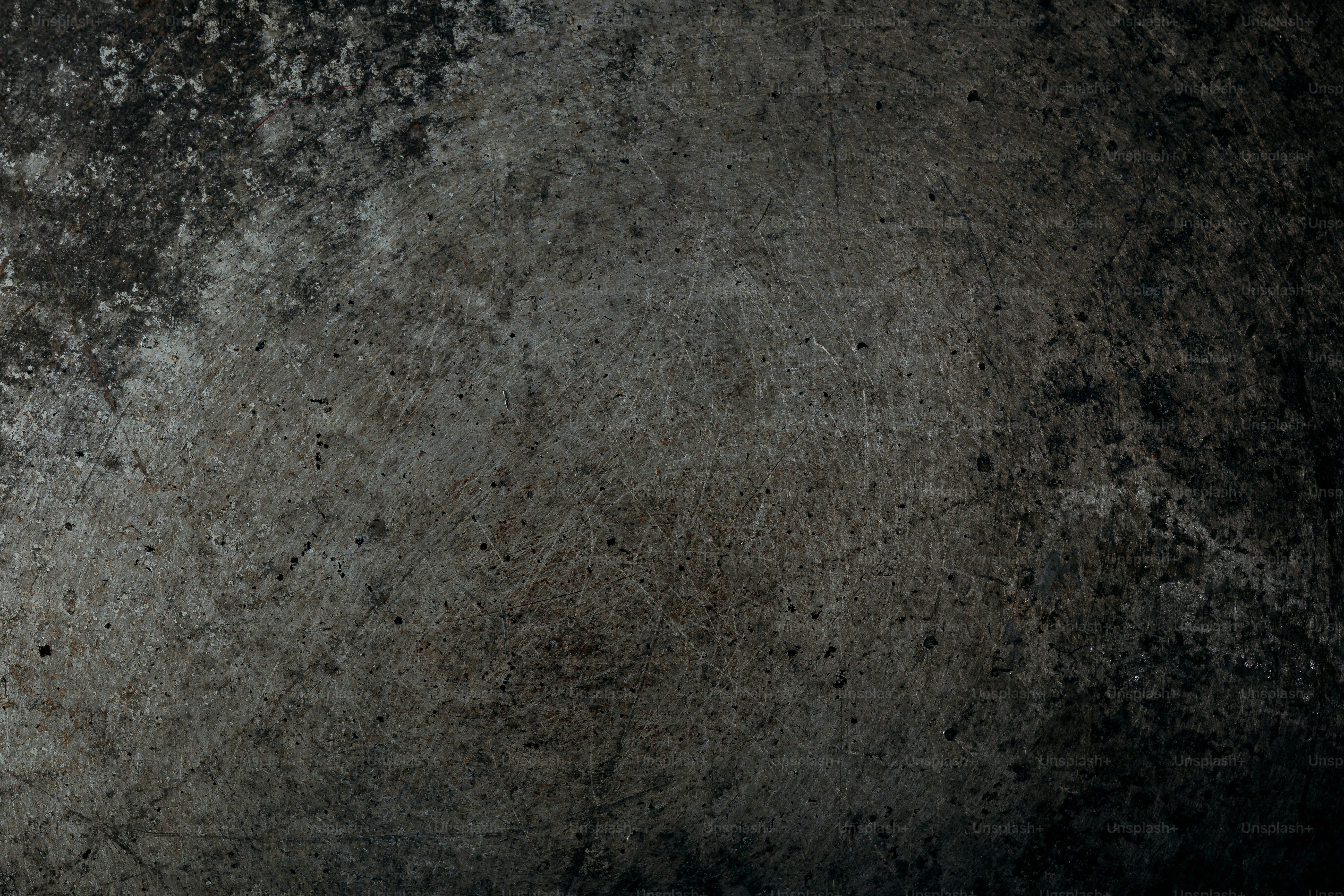 Grungy concrete texture with dark shadows