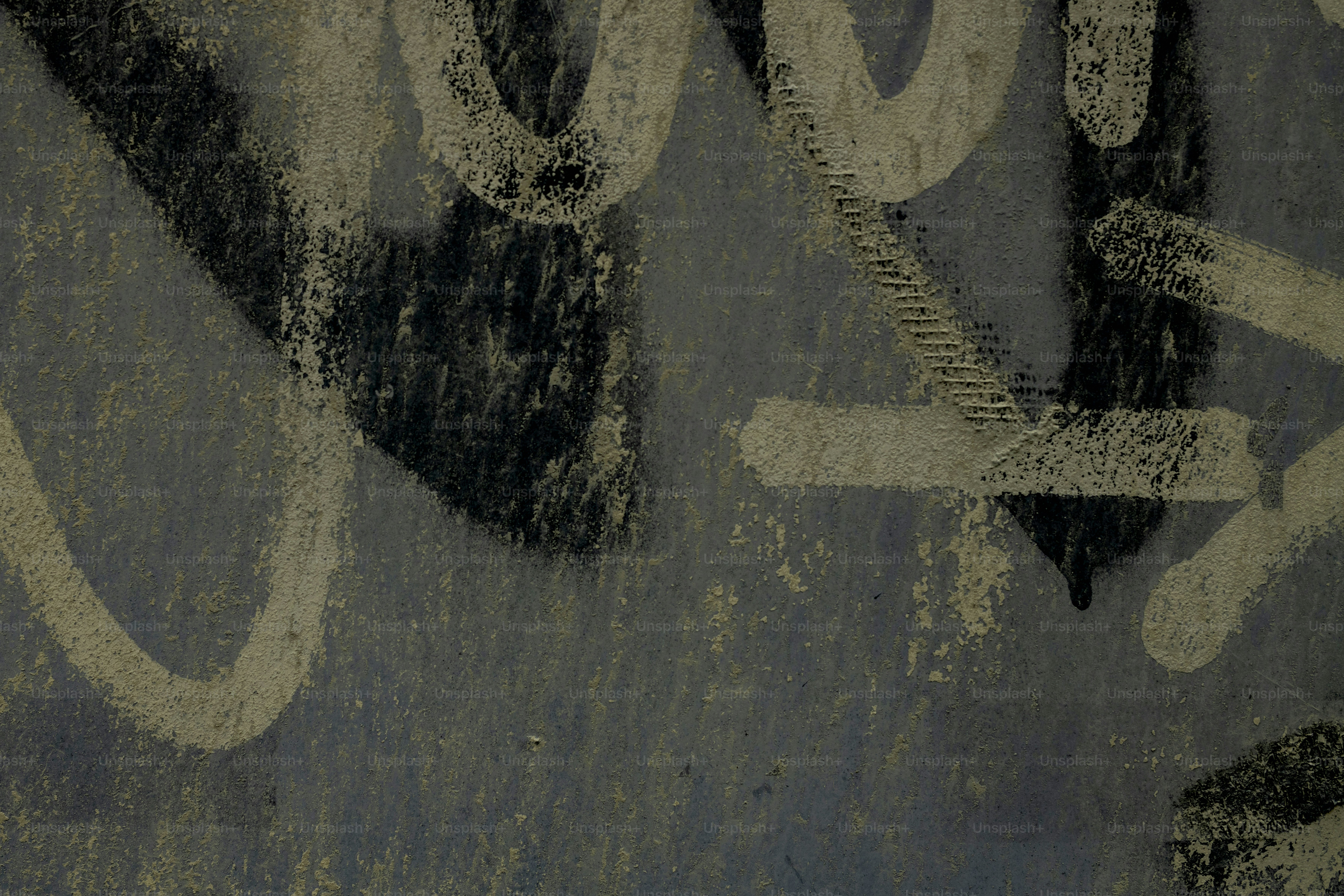 Close-up of graffiti on a blue wall