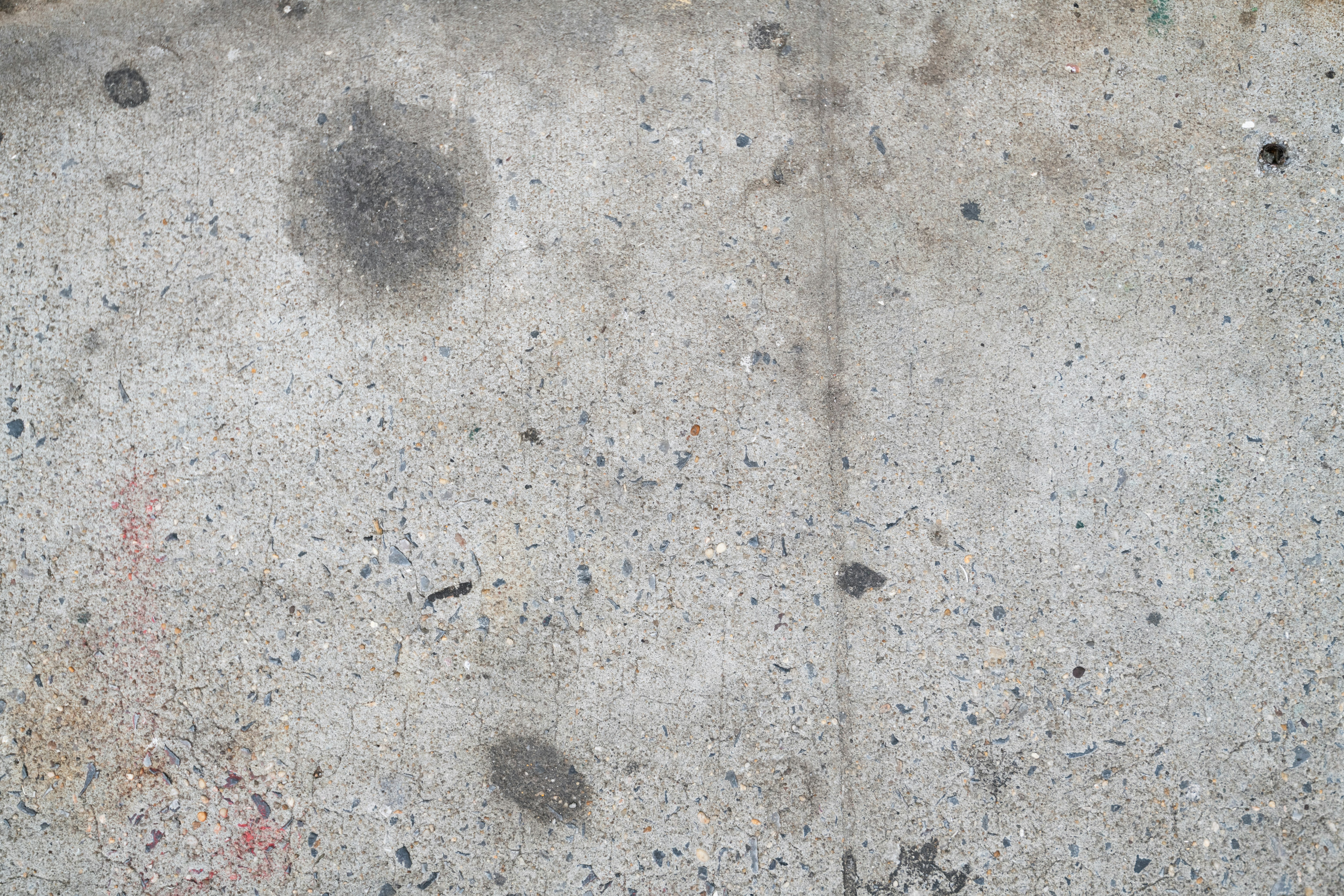 テクスチャーのあるコンクリート表面で、シミやゴミがついています