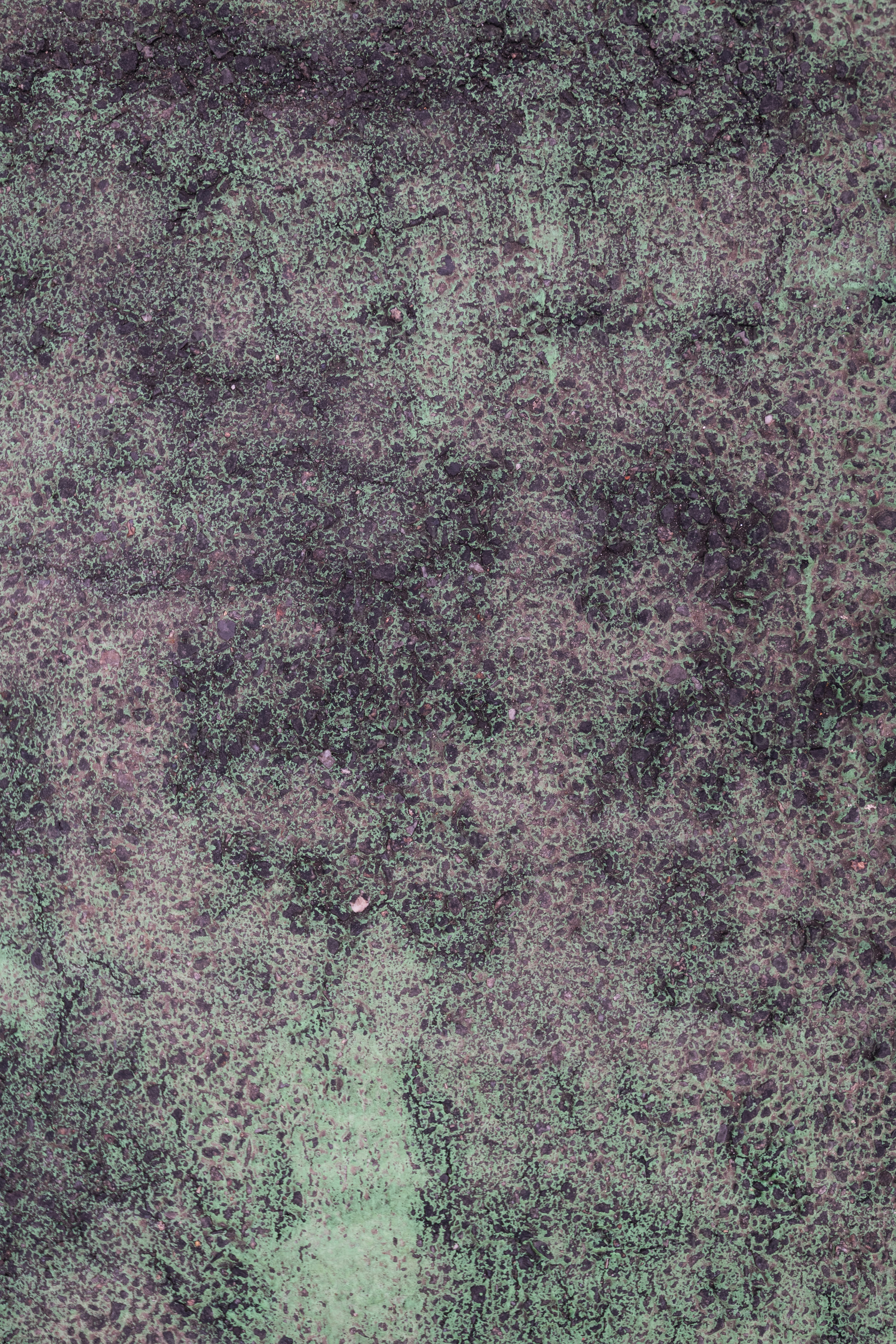 緑と紫の色調が入ったテクスチャーのある抽象背景