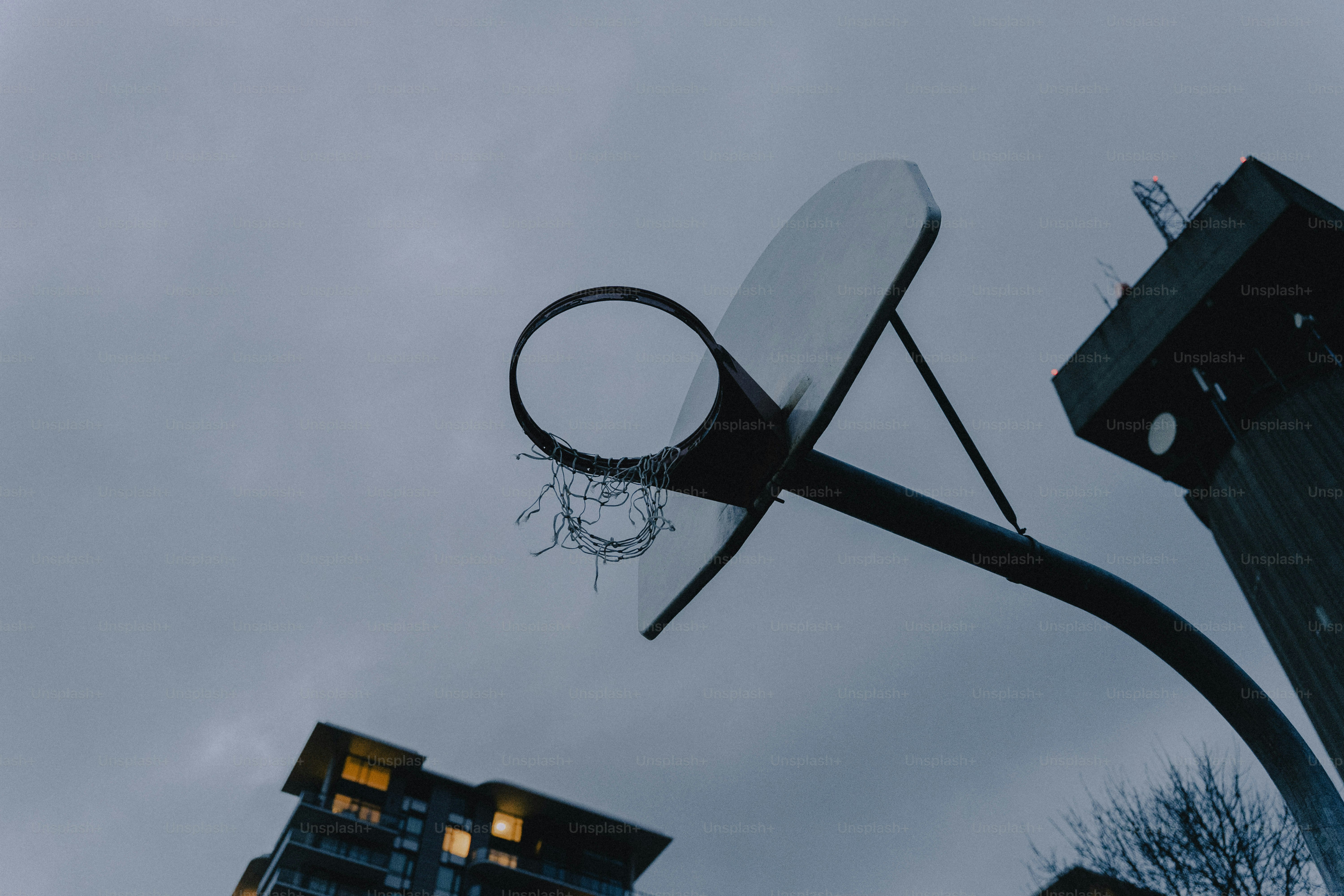 Basketball hoop against a cloudy sky