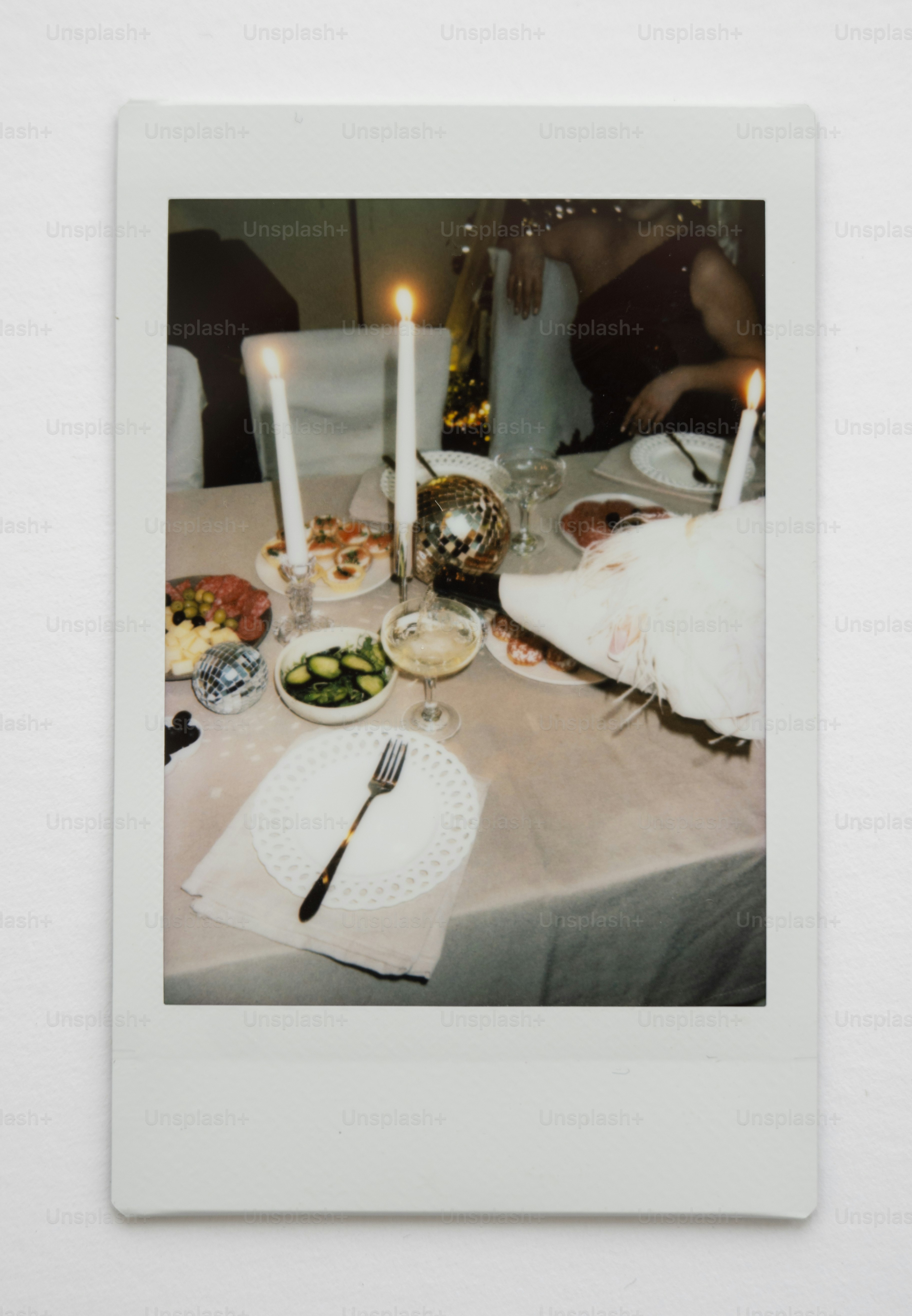 A festive table setting with food and candles.