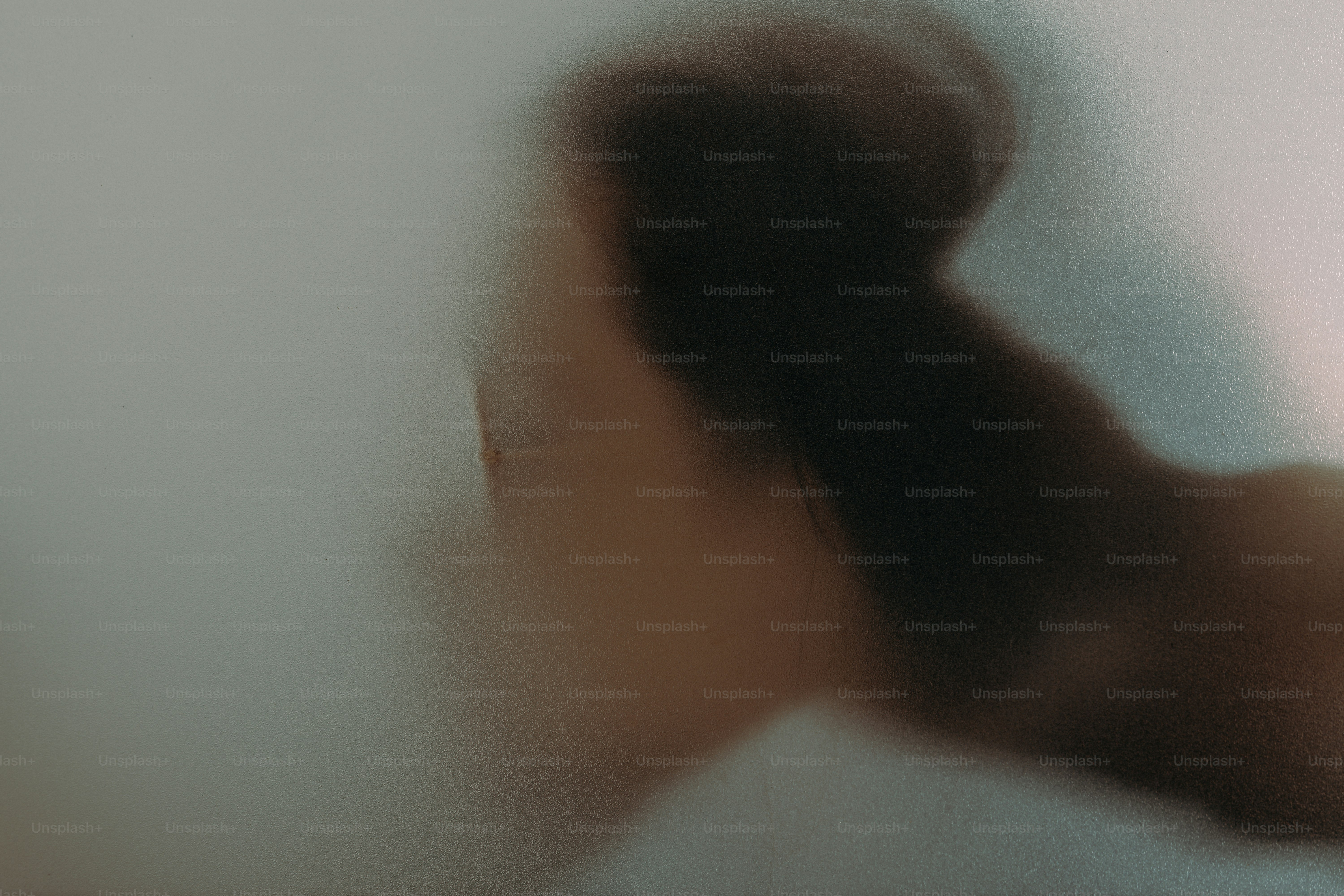 Blurred silhouette of a person's upper body