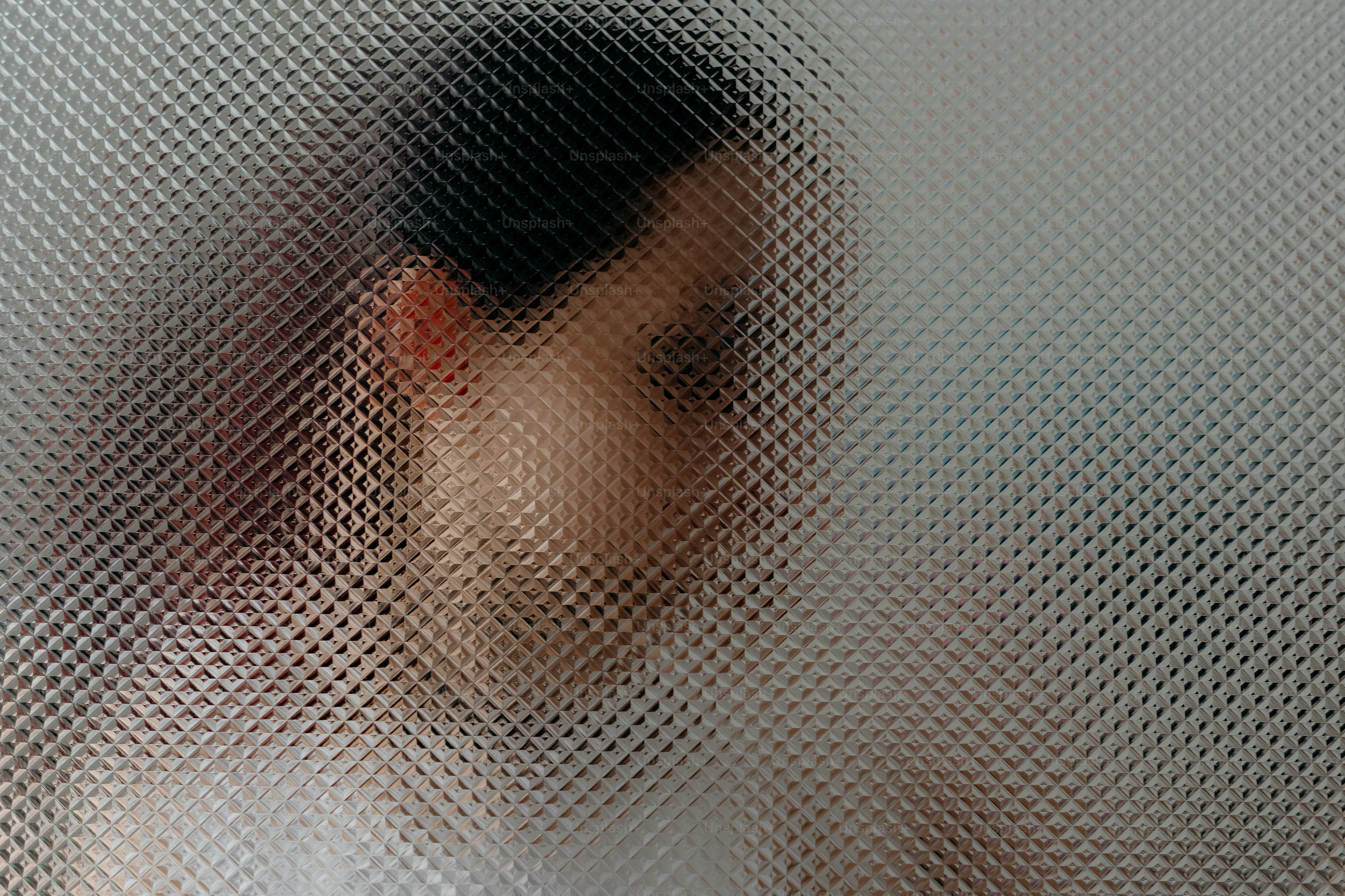 Blurry view of a person's head and shoulders