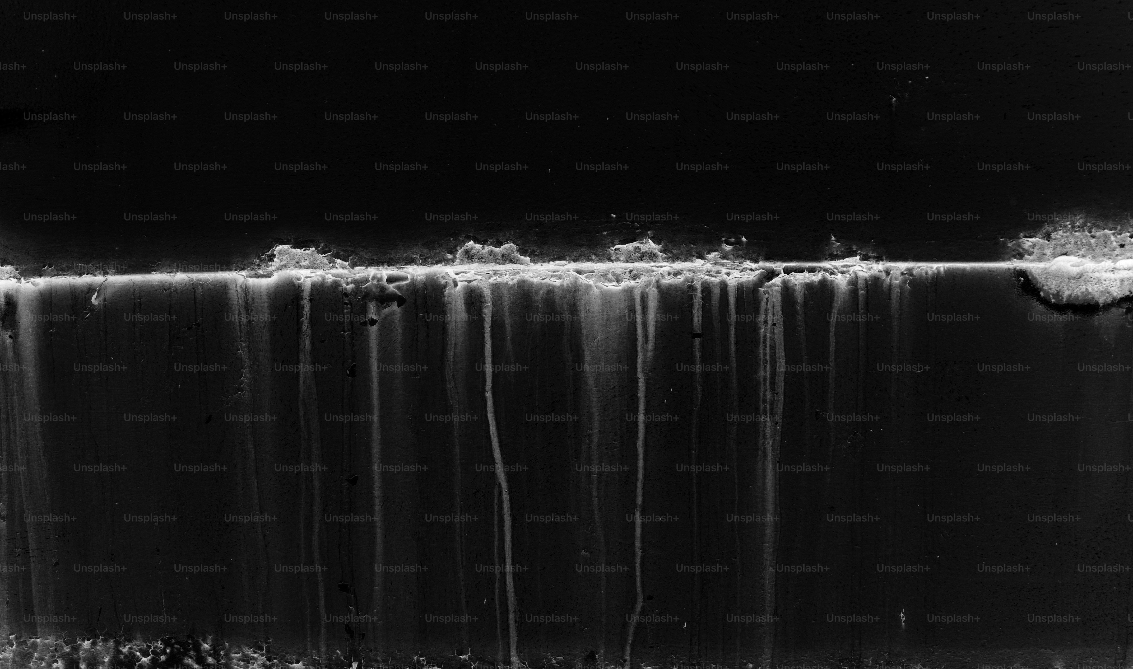 Abstract dark background with white streaks and textures