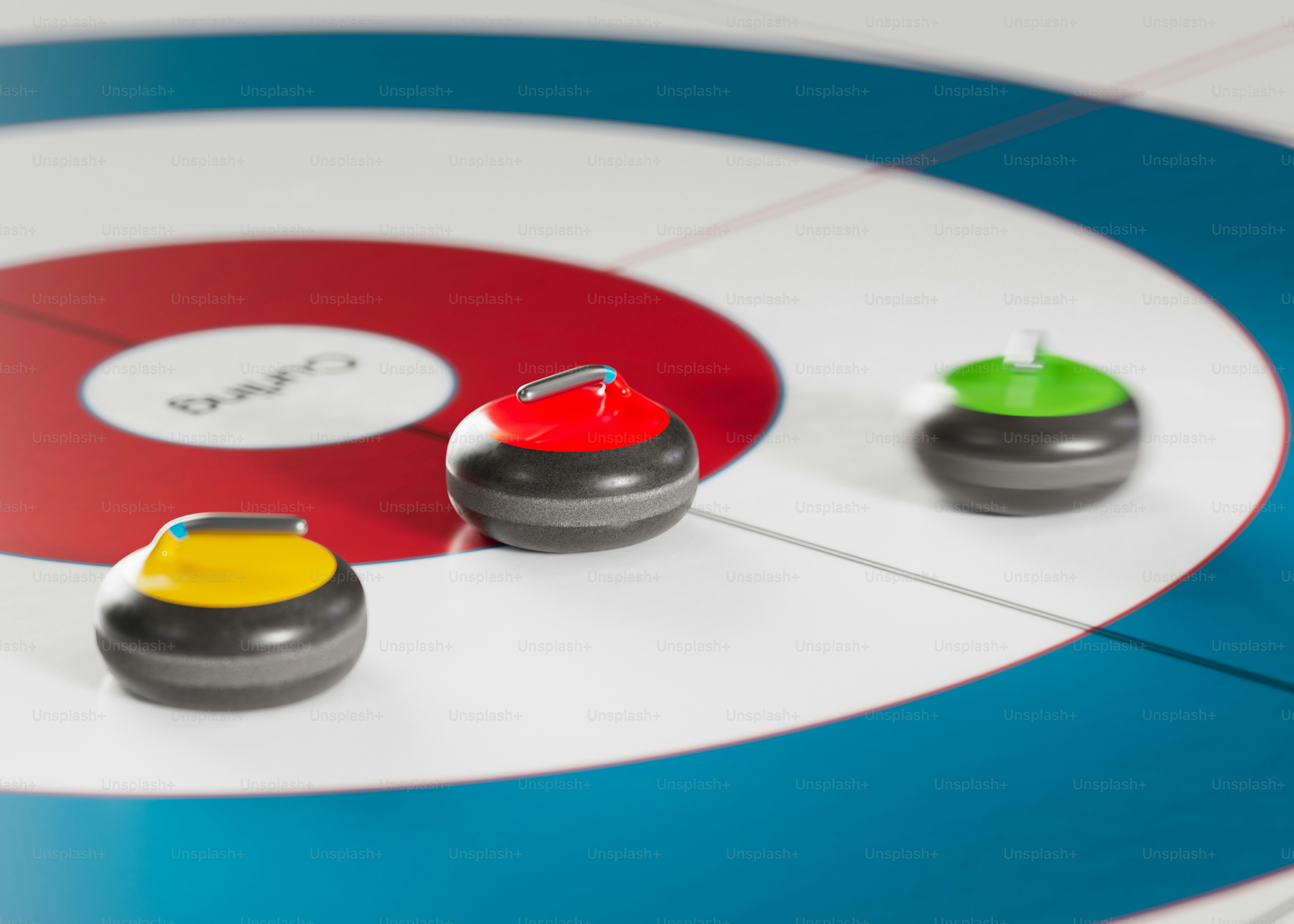 Three curling stones on ice with target