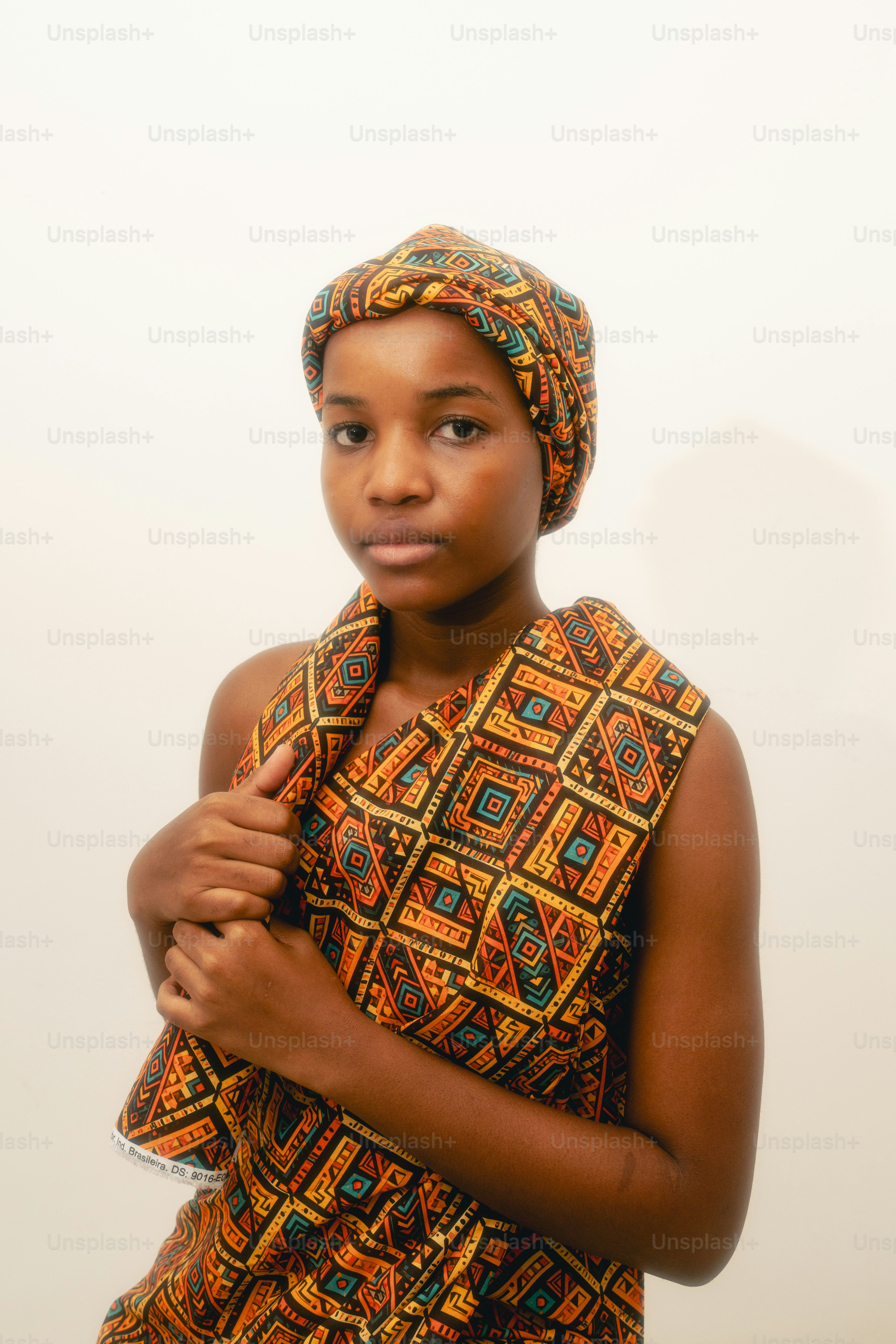 Young woman wearing traditional patterned african clothing