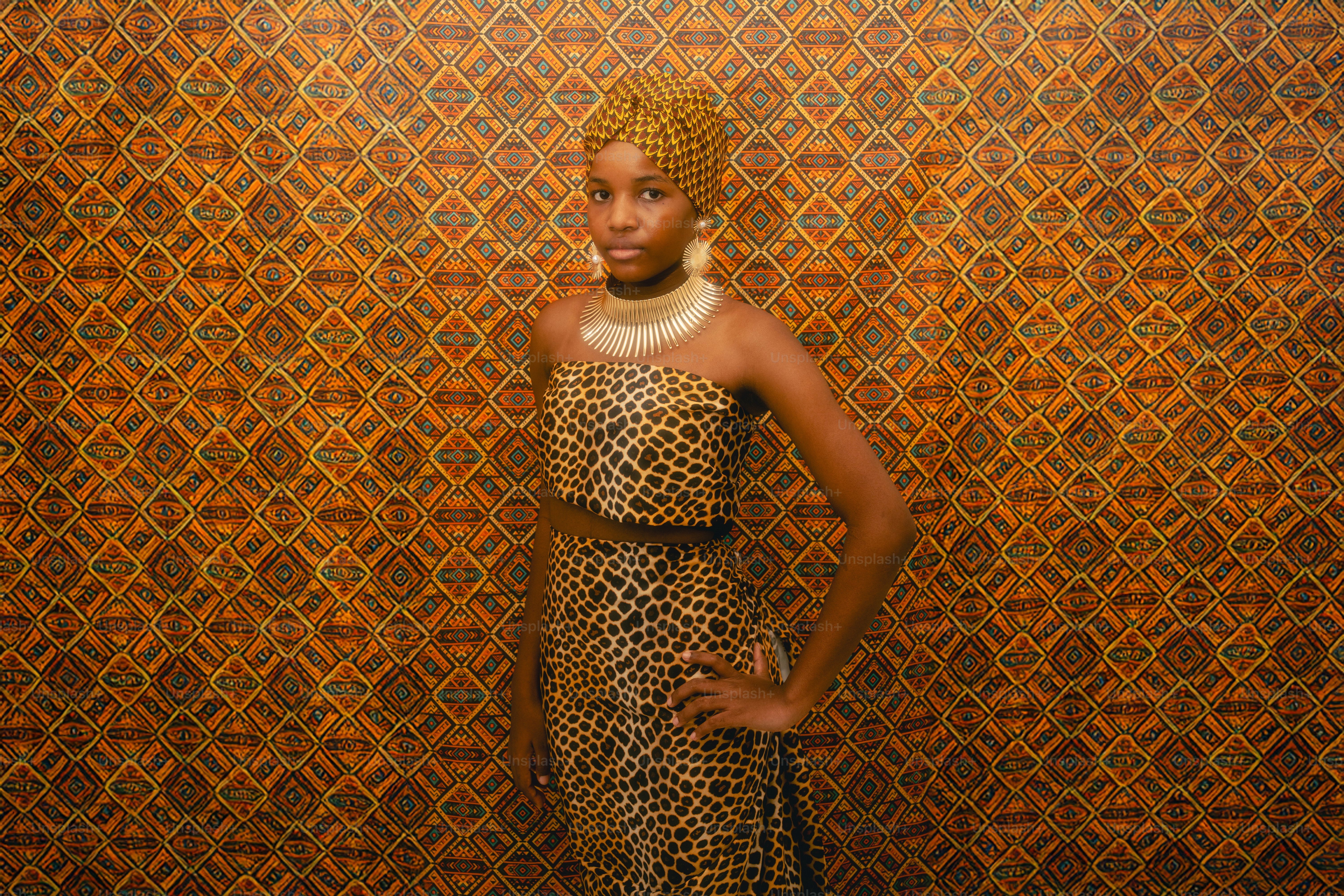 Young woman in leopard print dress and headwrap