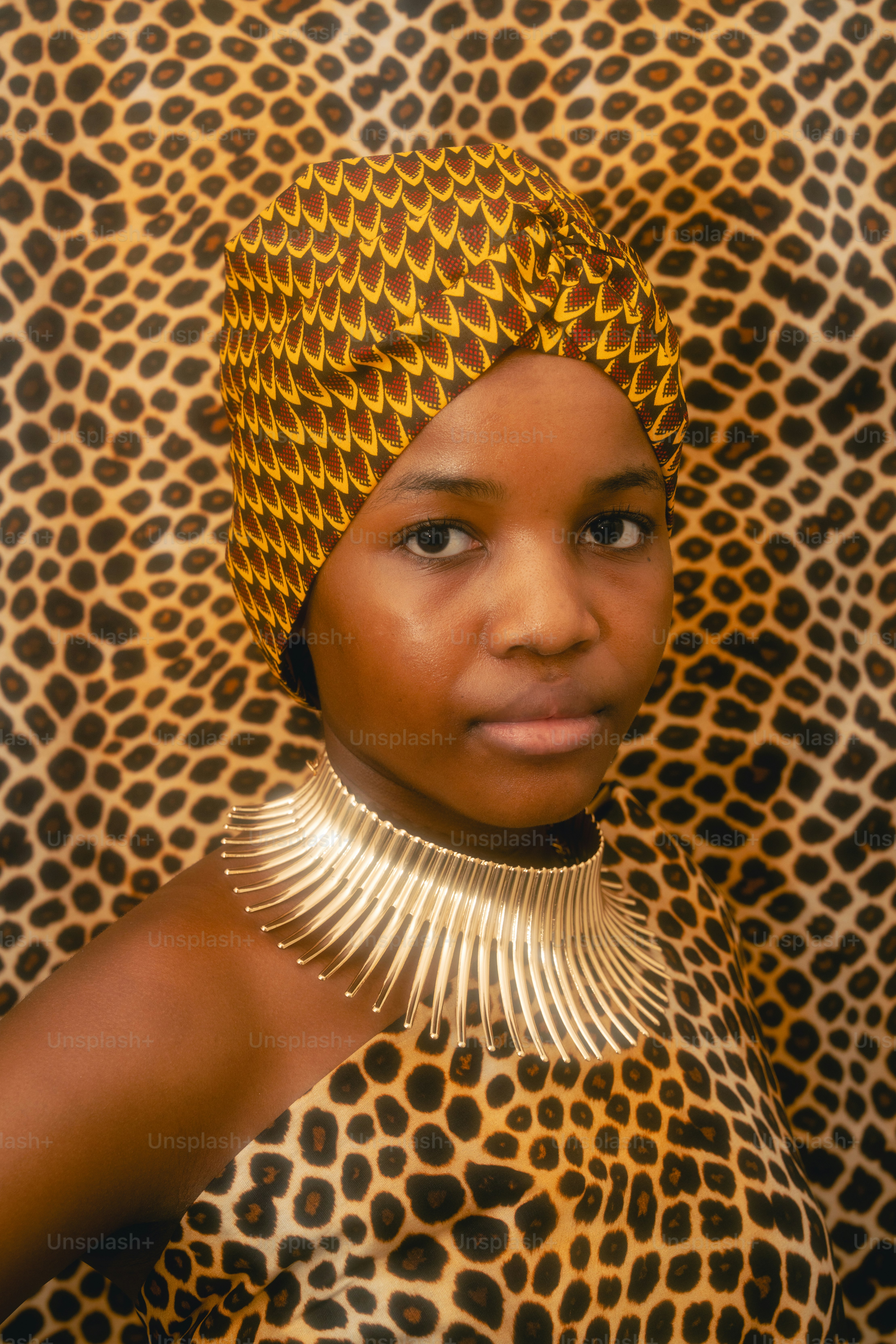 Young woman in leopard print and headscarf