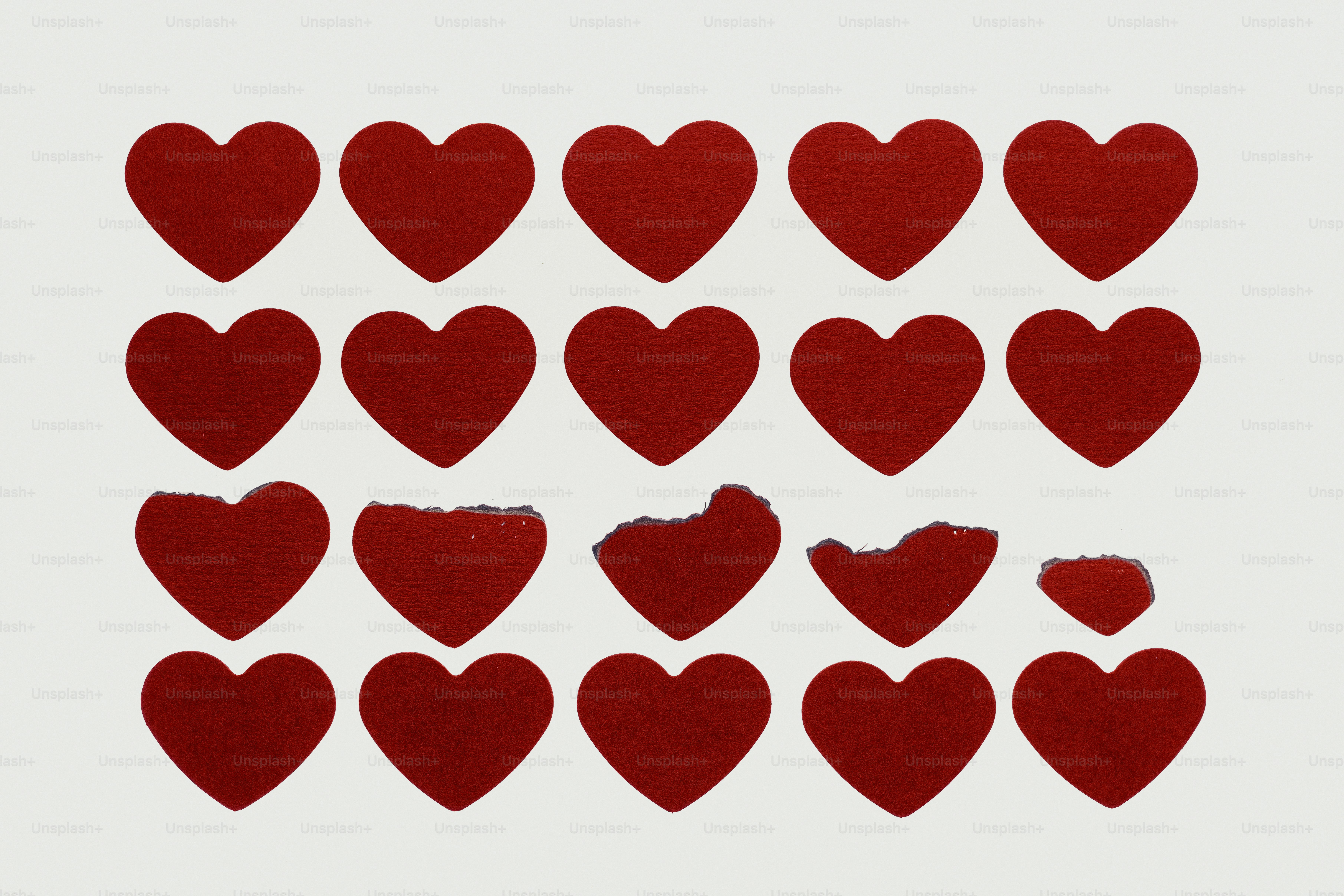 Several red hearts on a white background