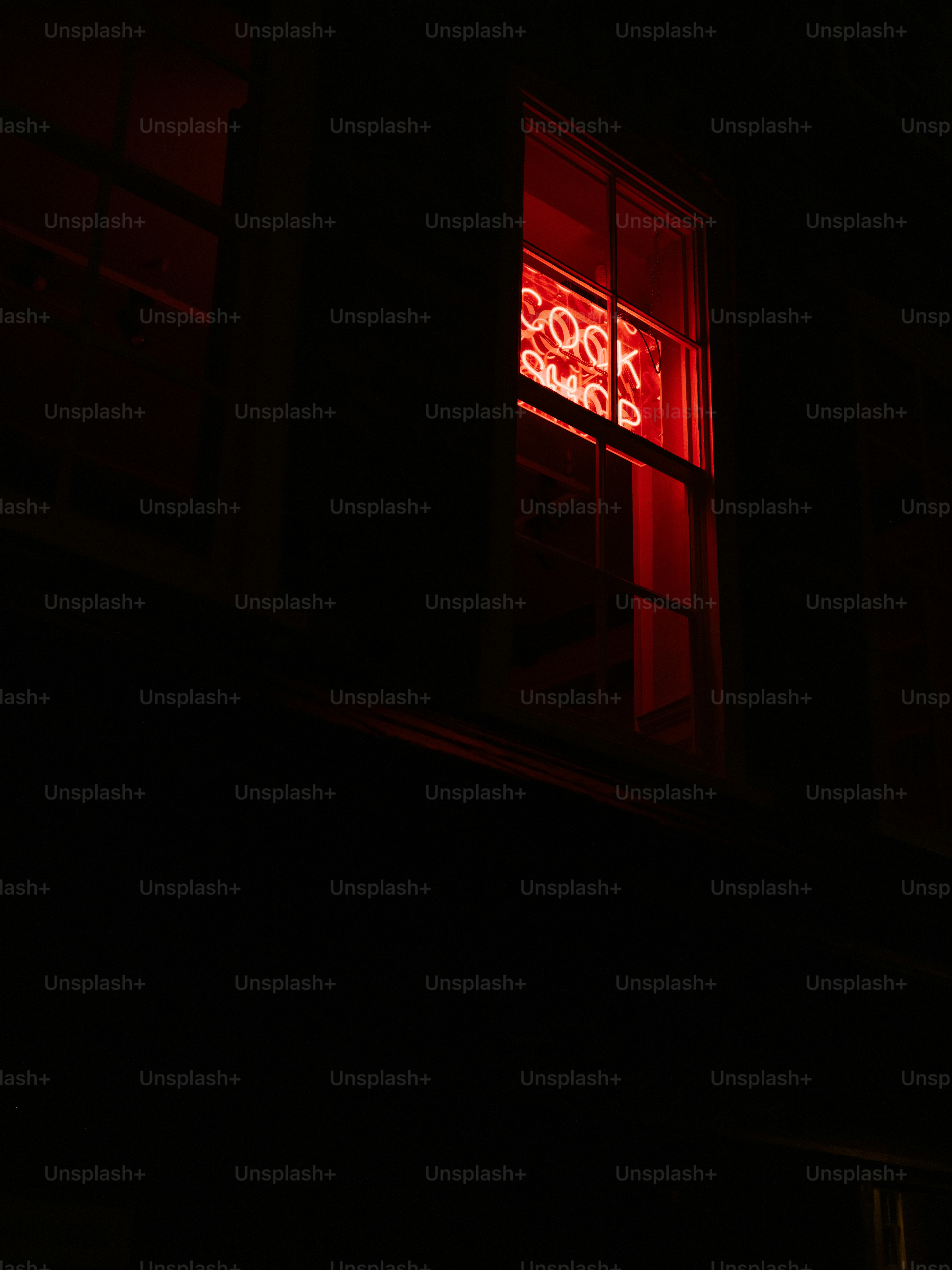 Red neon sign for book shop in window