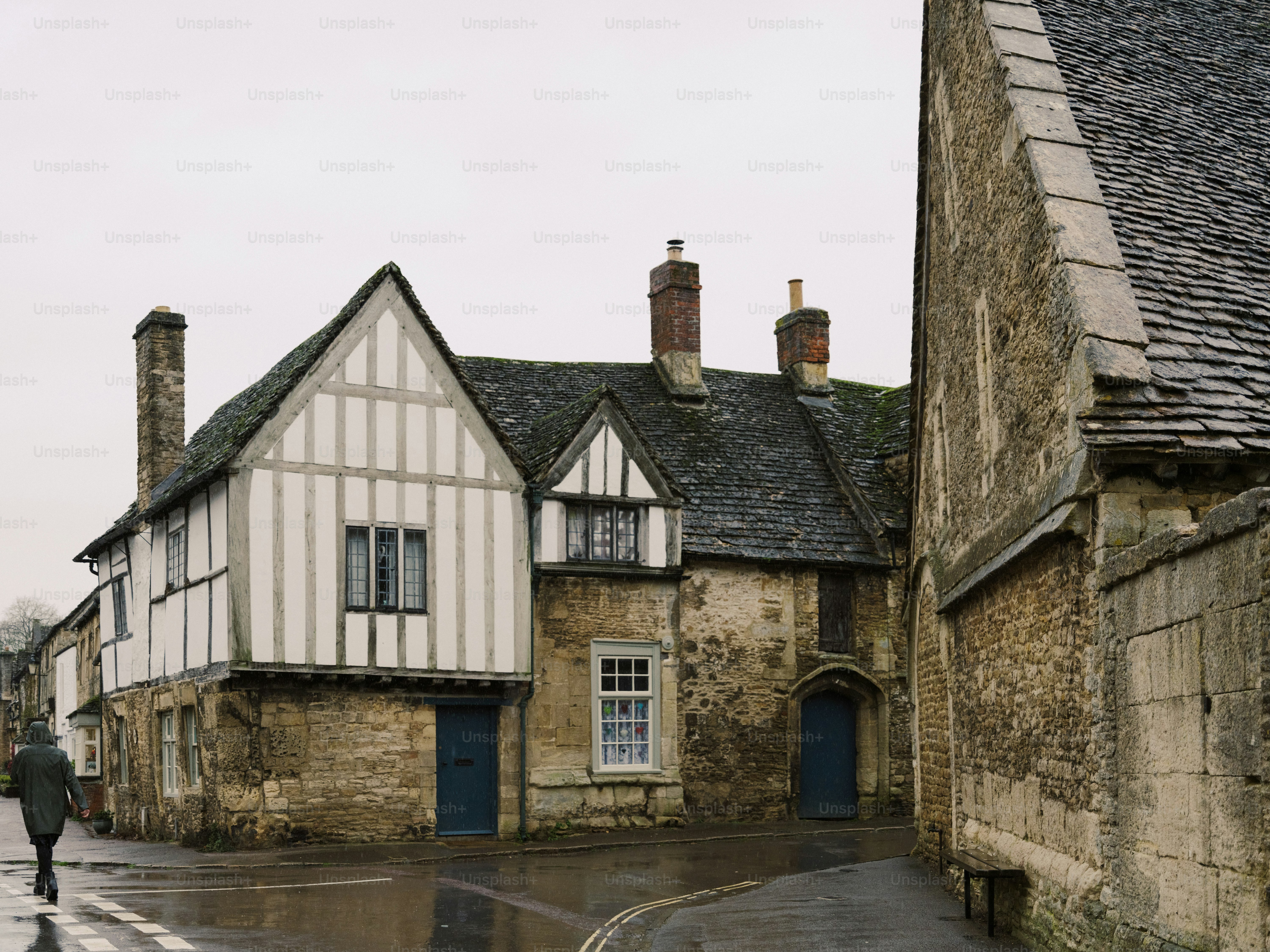 Old timber-framed building on a wet street
