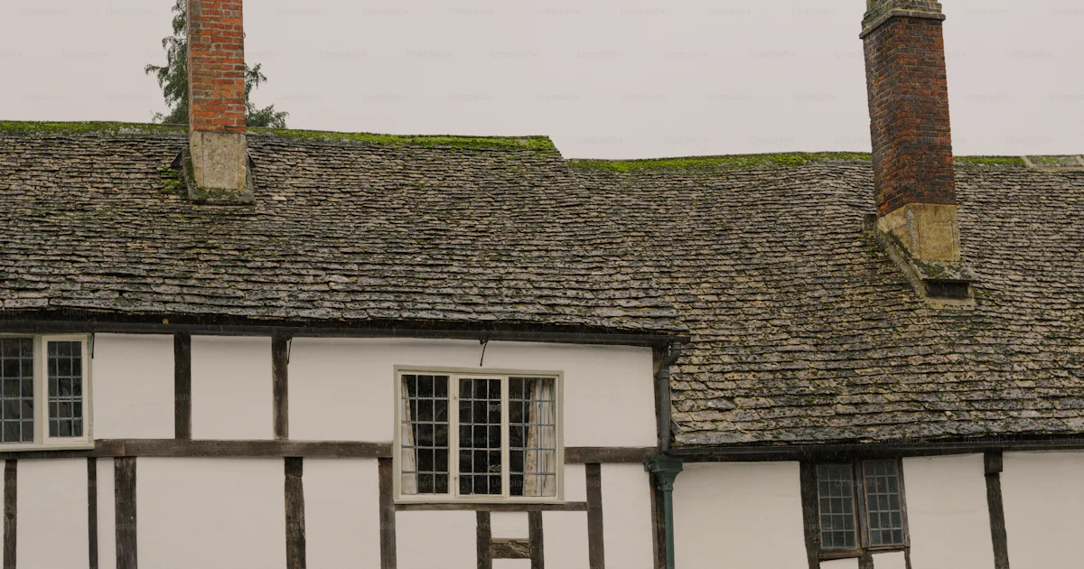 First Timber Frame Building Historic timber-framed building with stone roof photo – Vintage Image ...