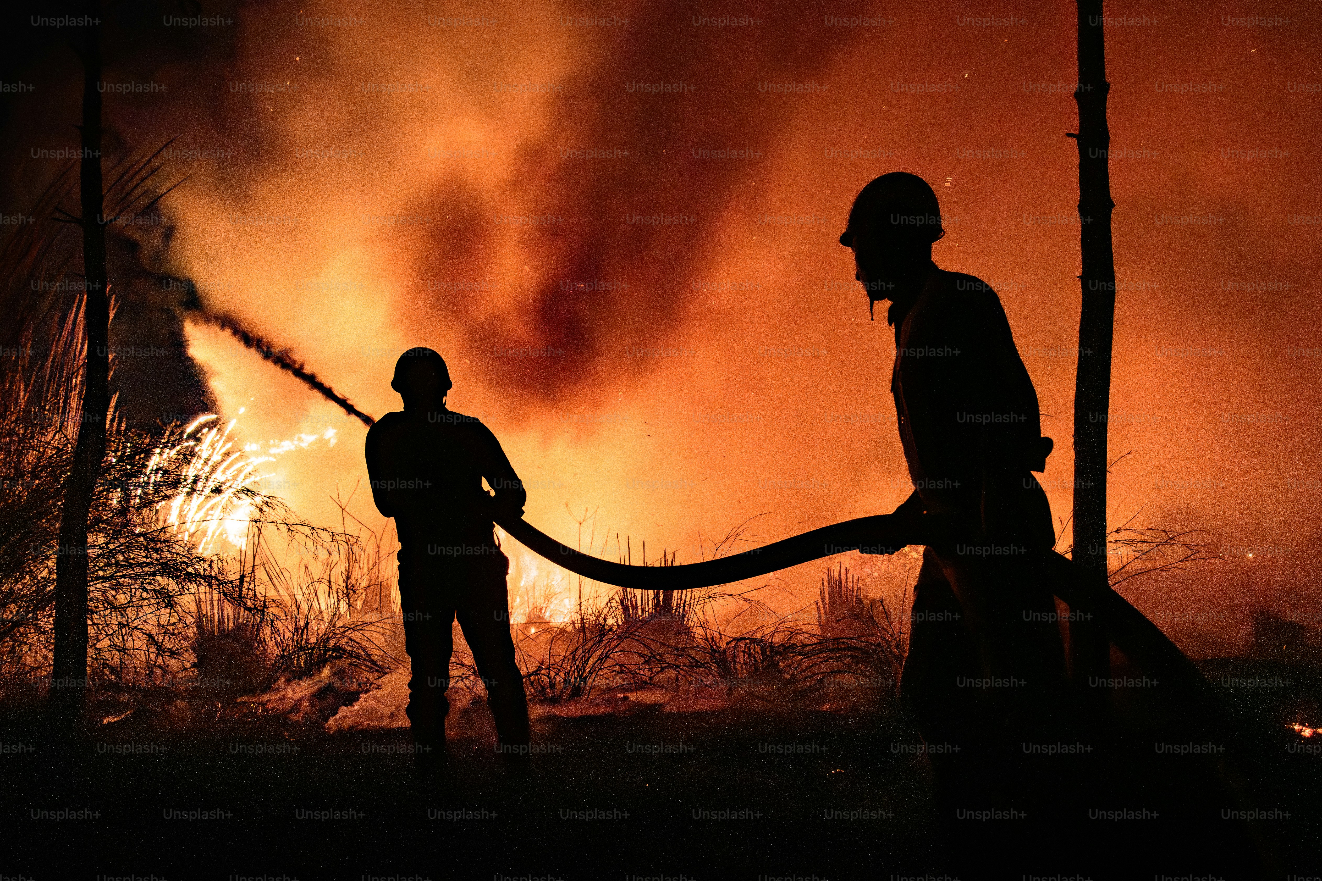 Firefighters battling a large blaze at night