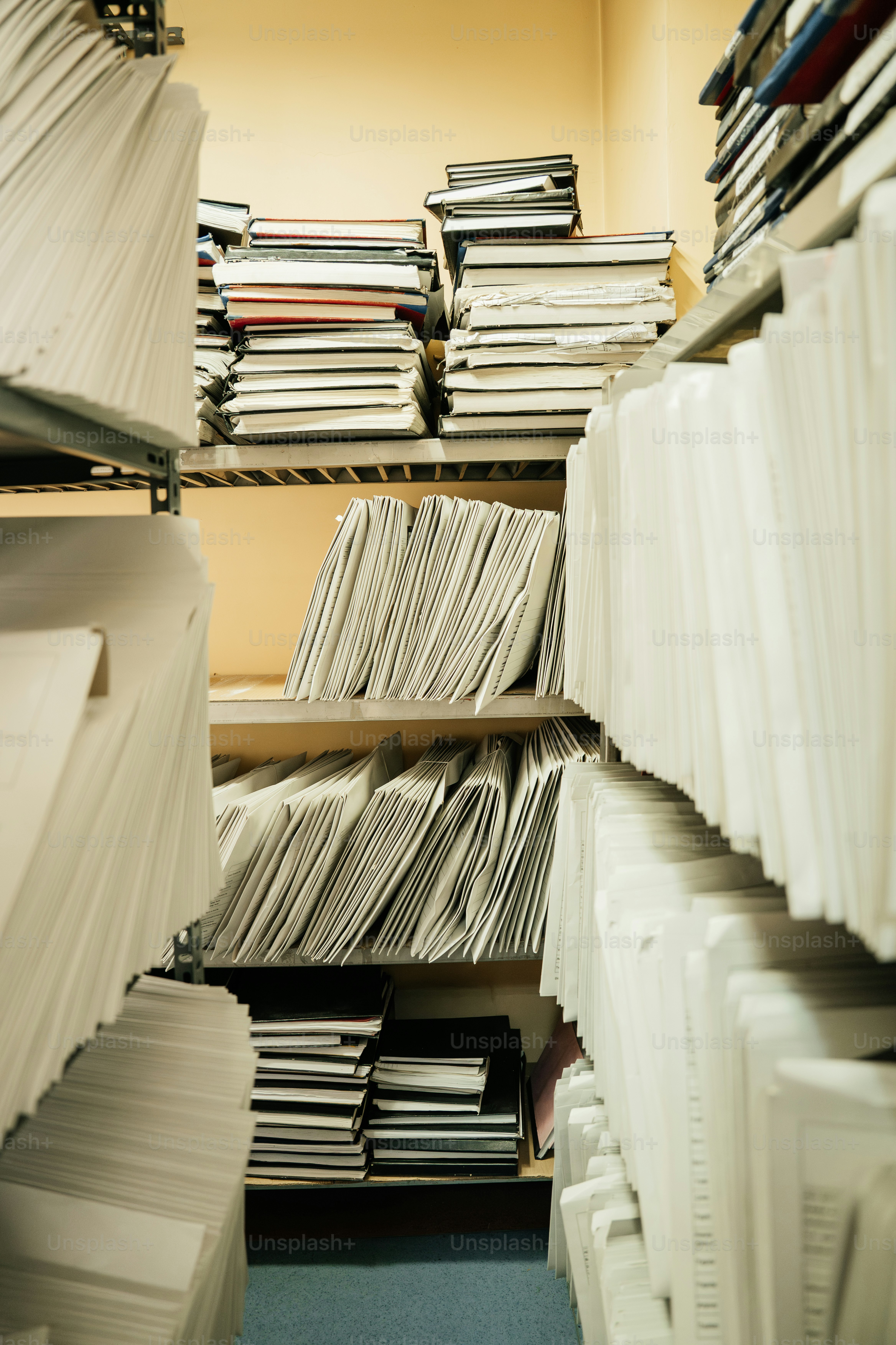 Shelves filled with stacks of paper and files.