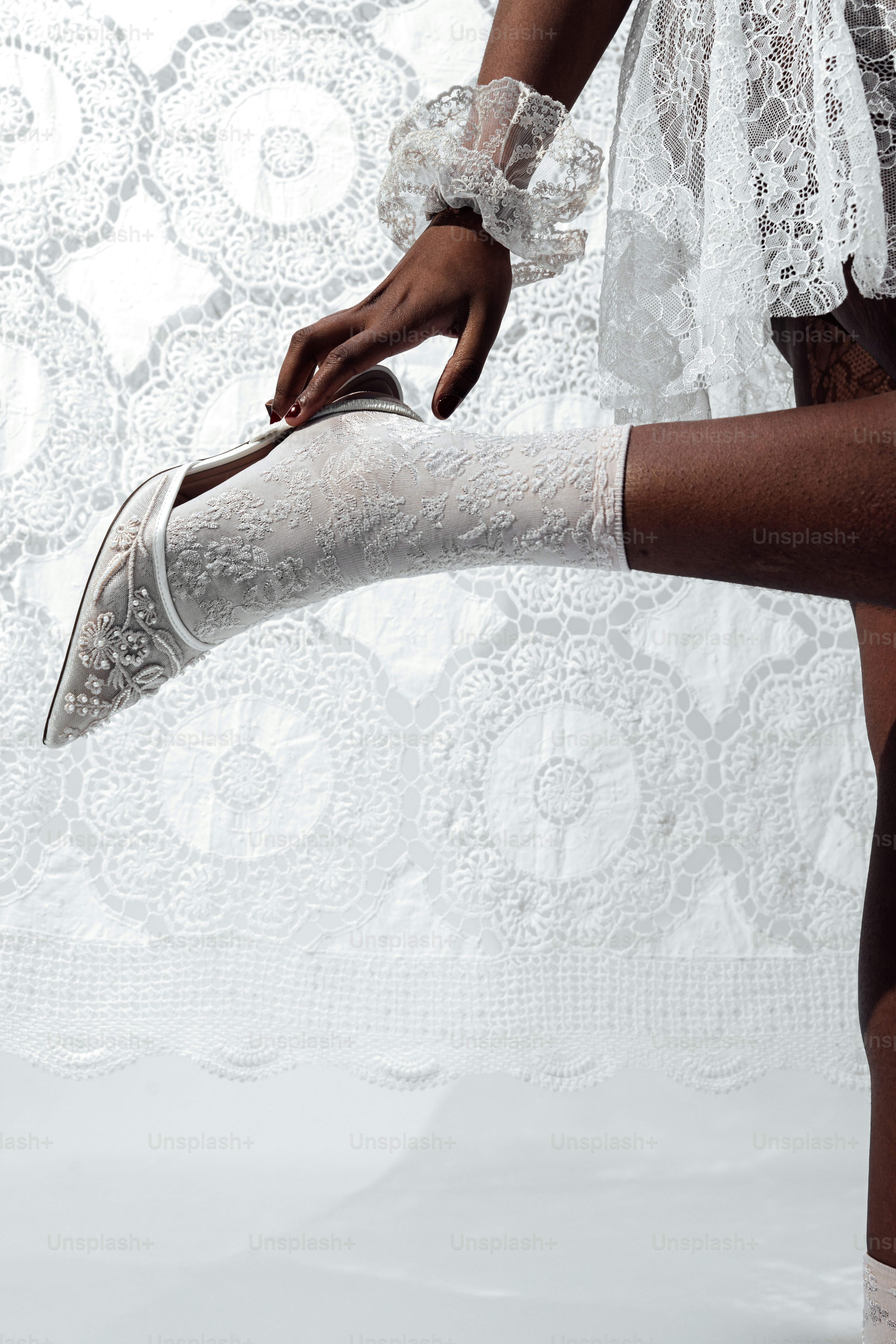 Person adjusting white lace shoe and sock photo  High heel Image on  Unsplash