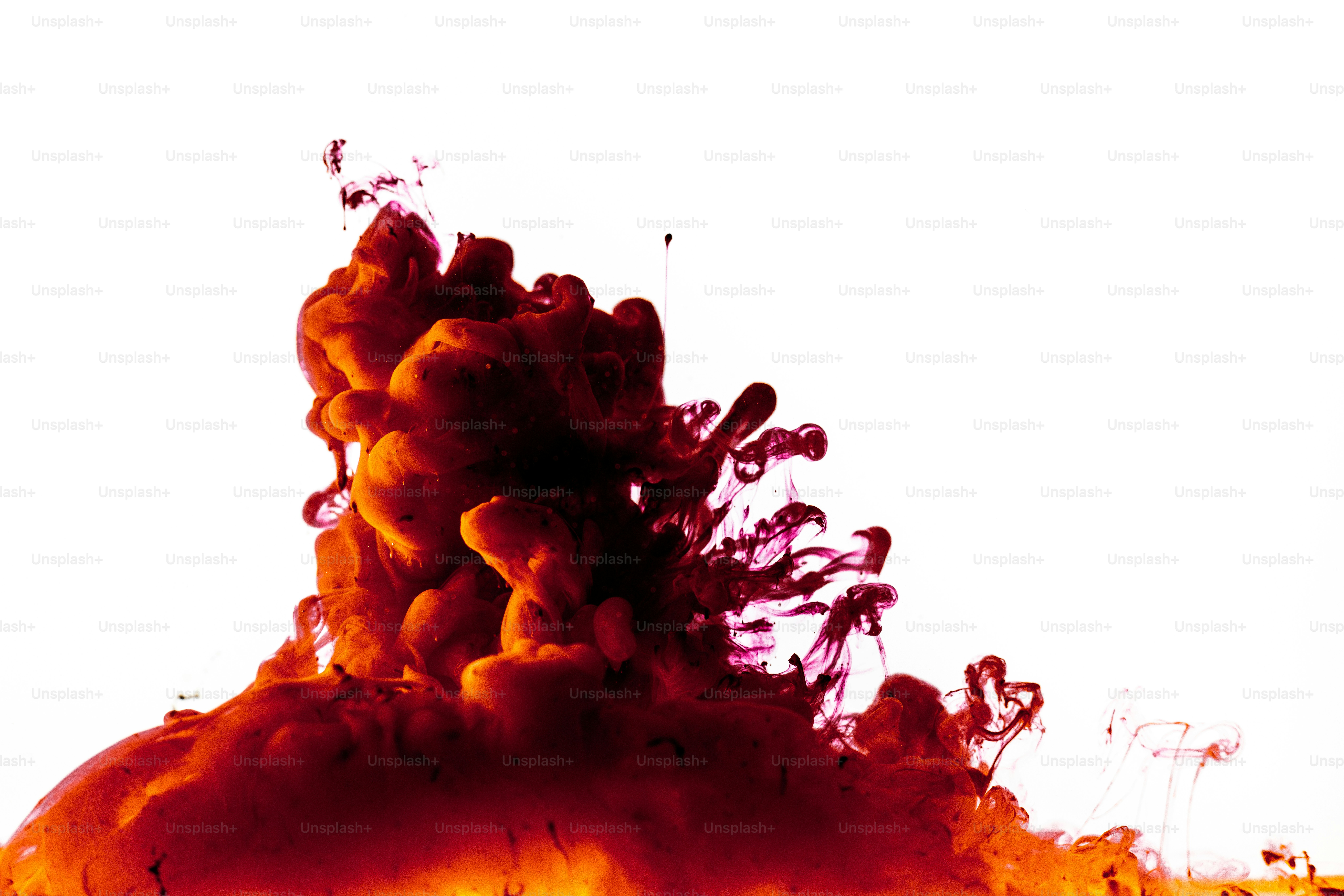 Red ink cloud blooming in white water