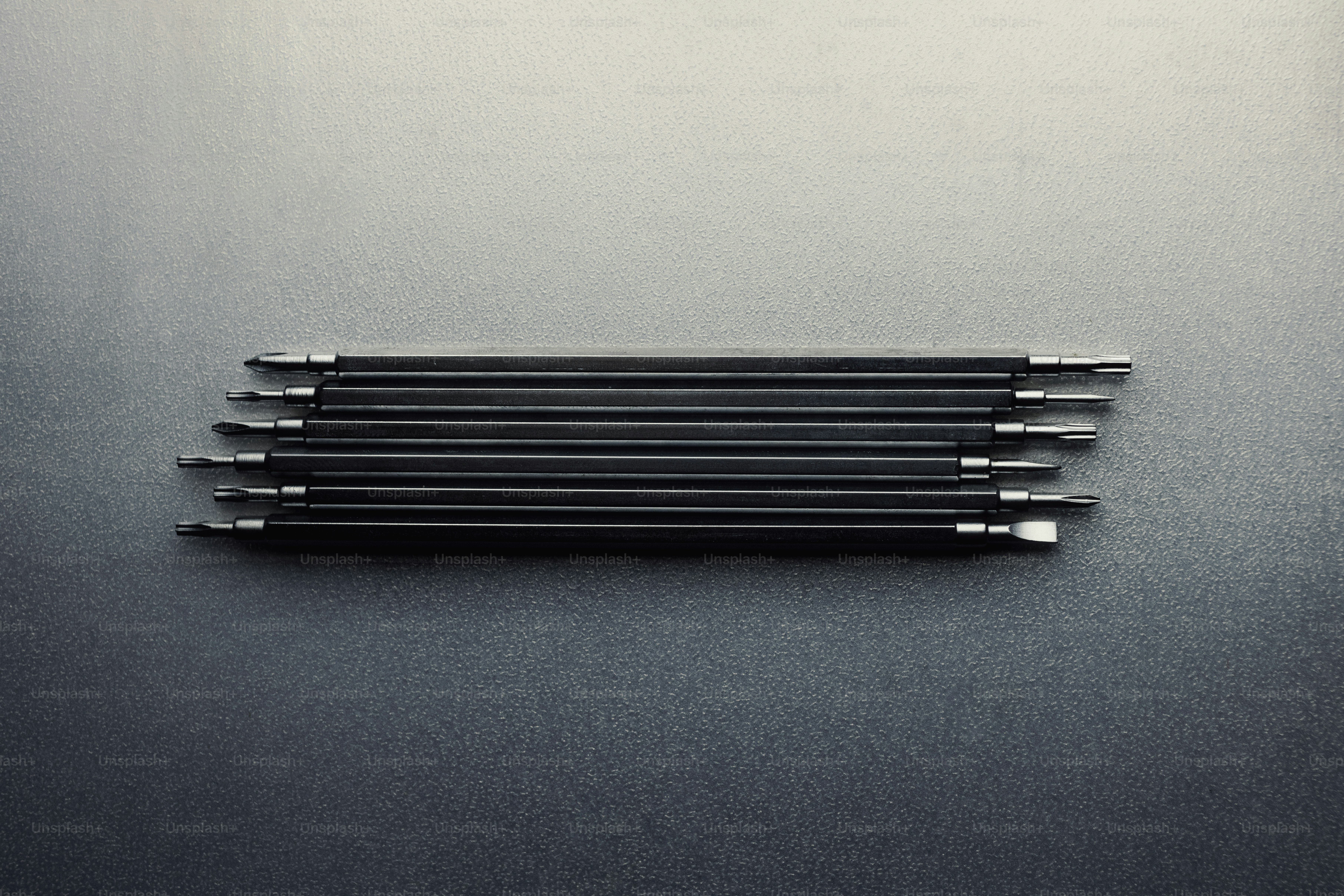 Several black metal rods arranged horizontally