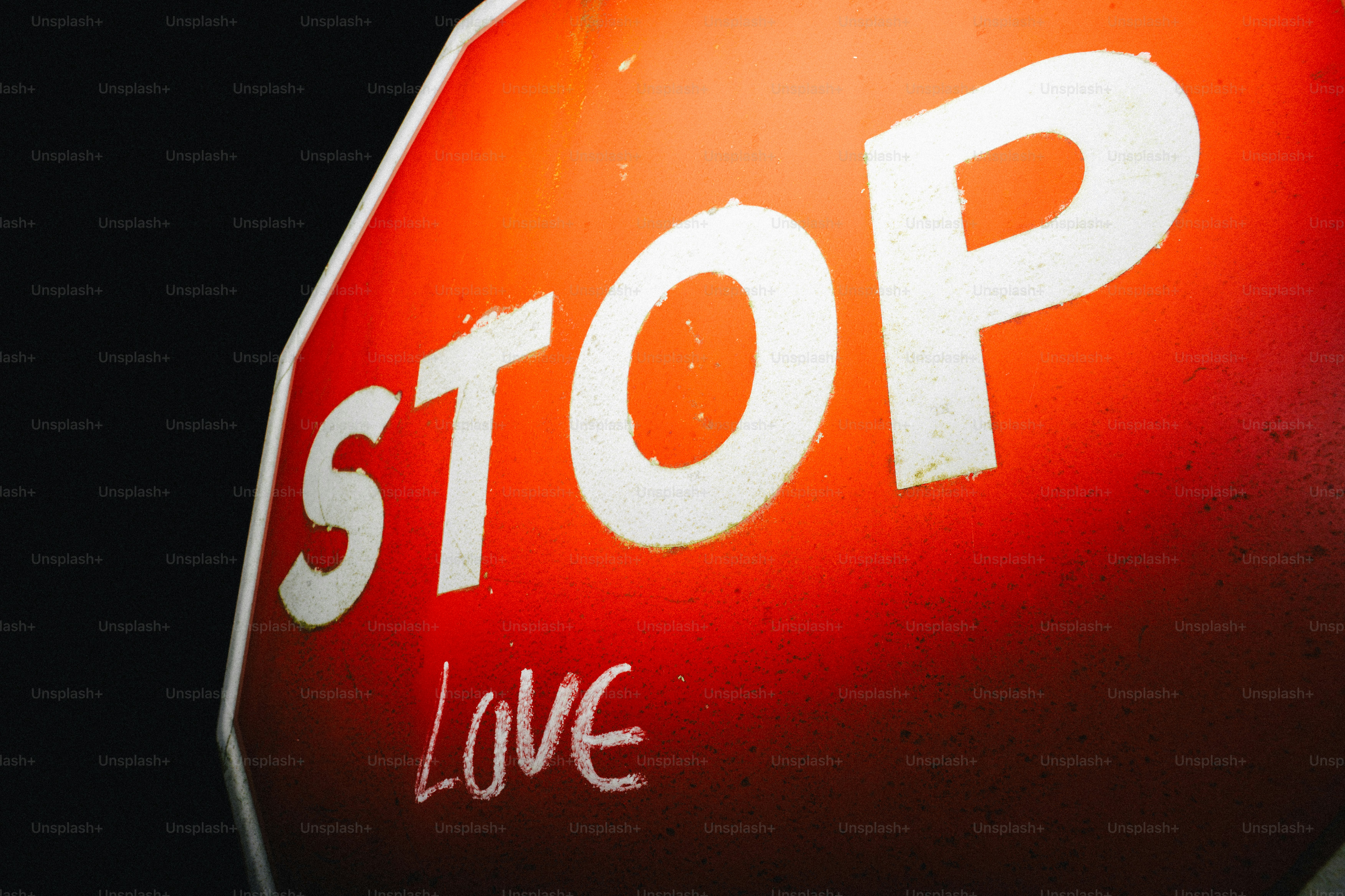 A stop sign with the word love written on it.