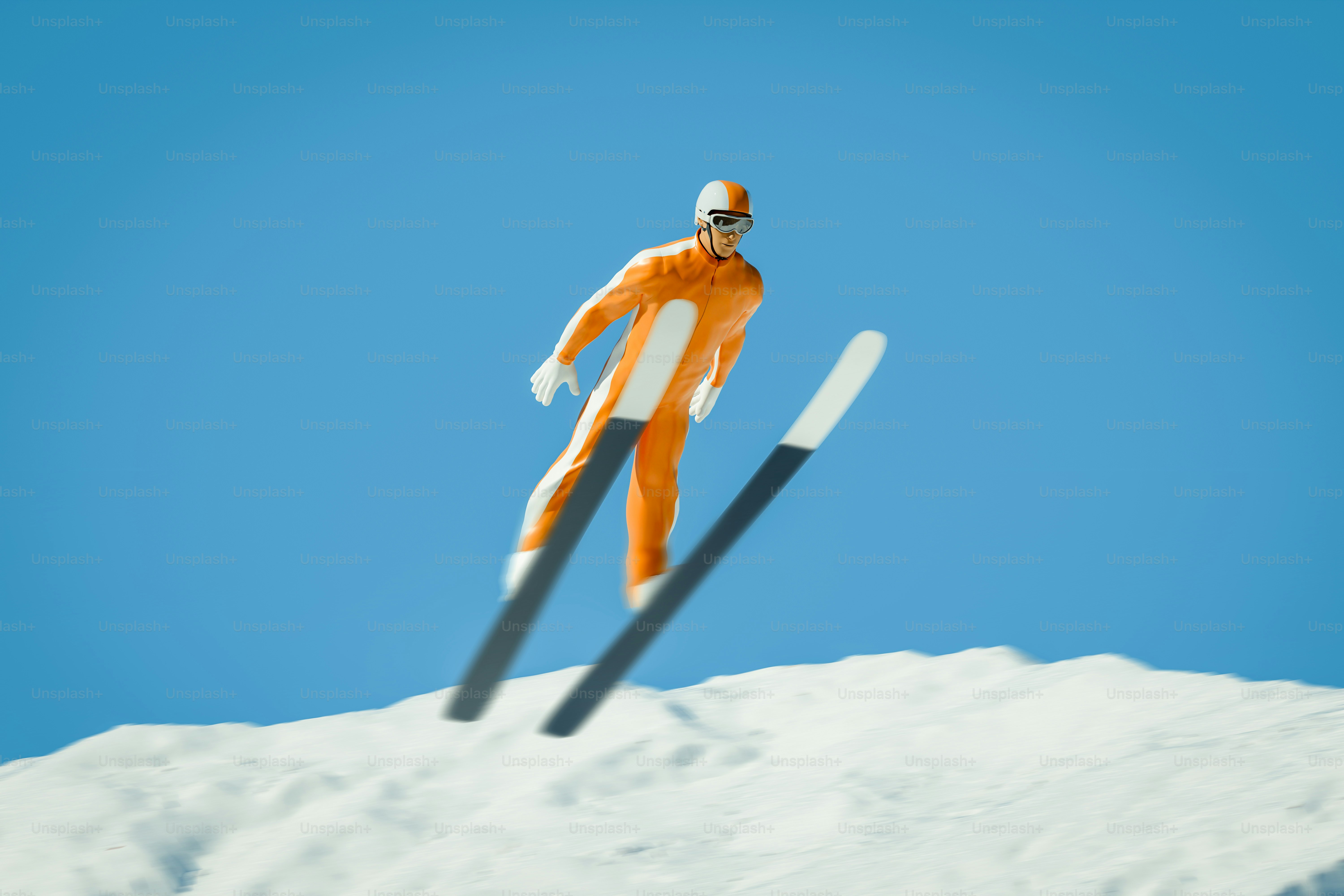 A ski jumper in mid-air against a blue sky.