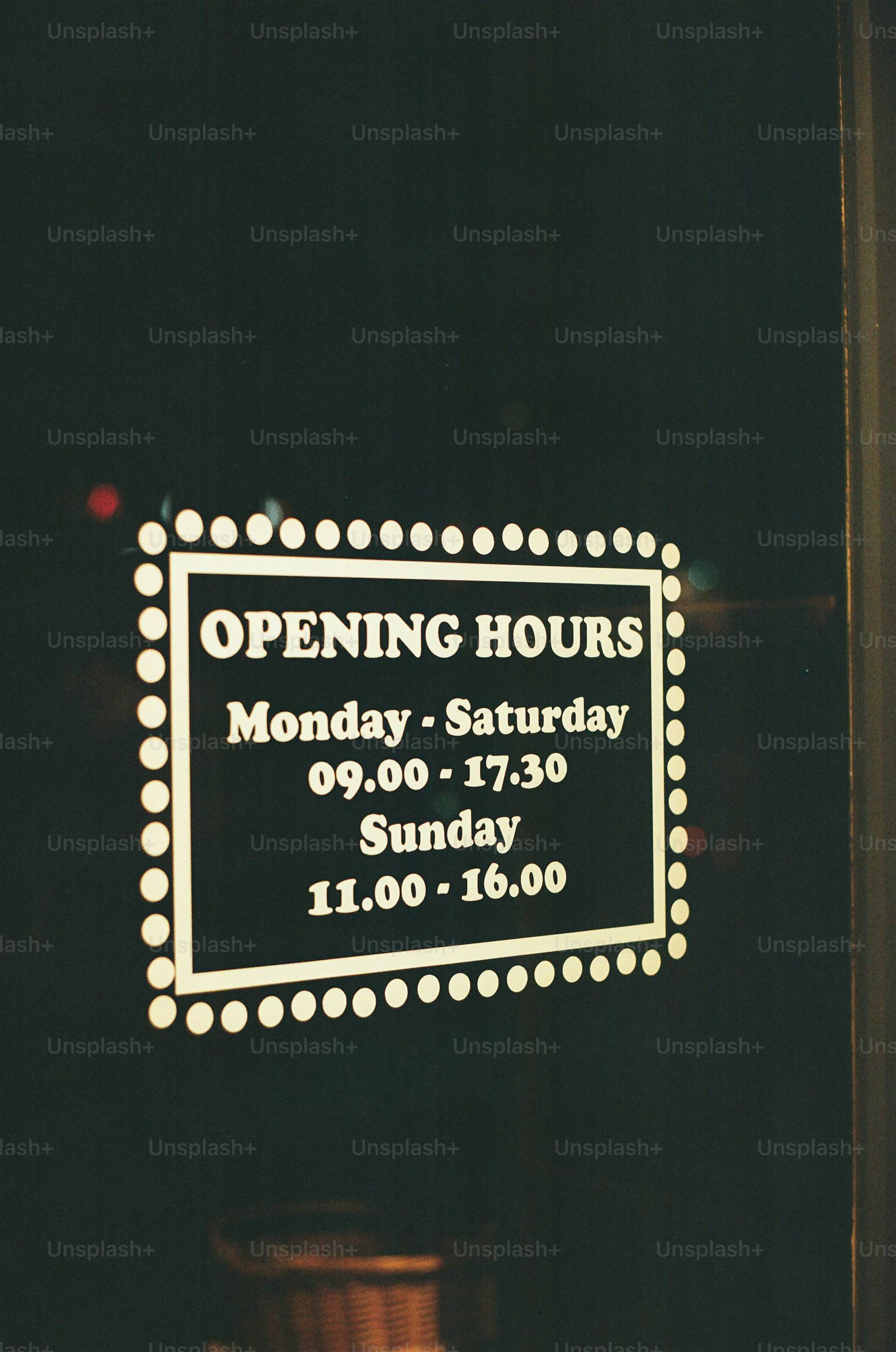 Opening hours sign on a dark background photo – Business Image on Unsplash