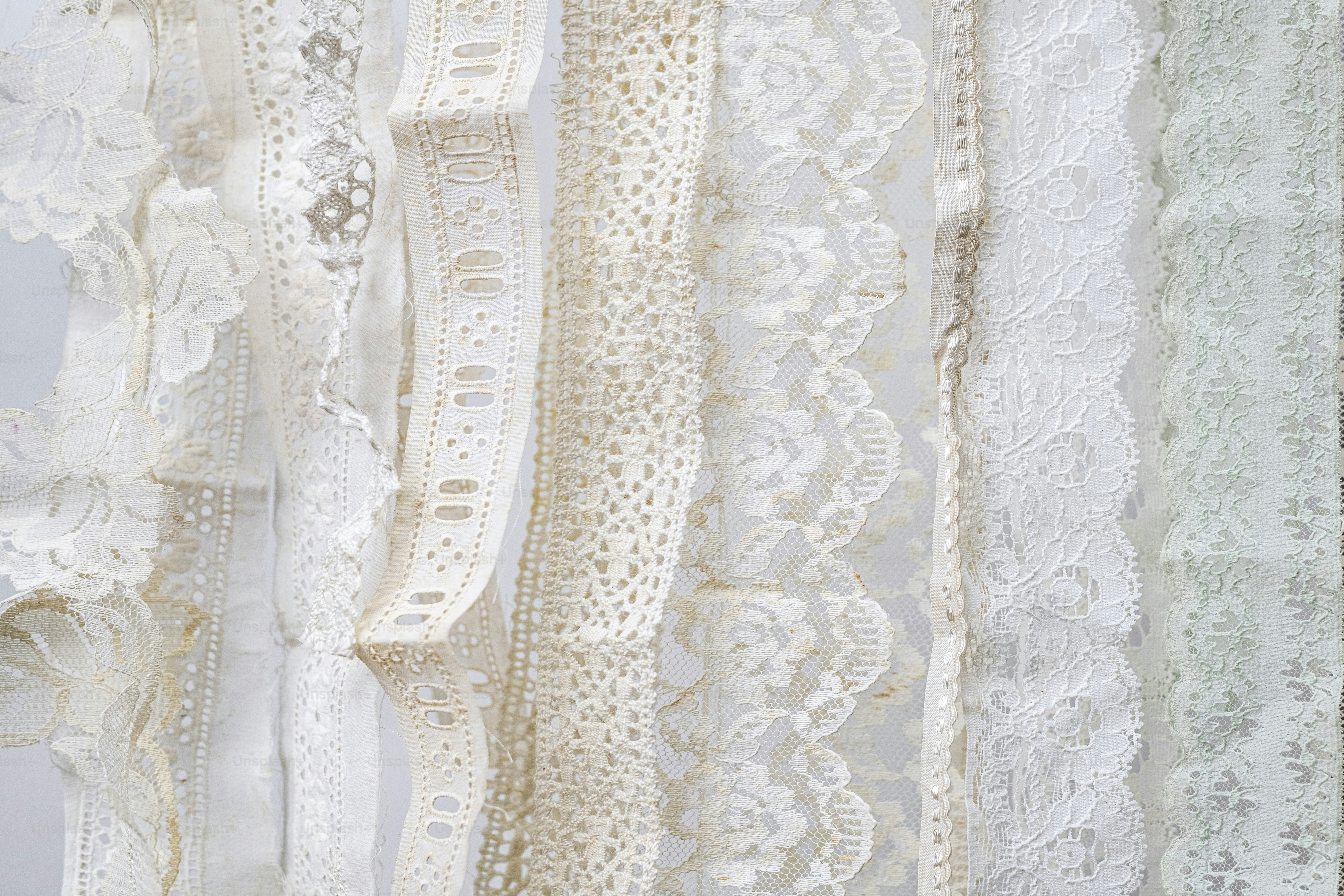 Collection of various white and cream lace trims